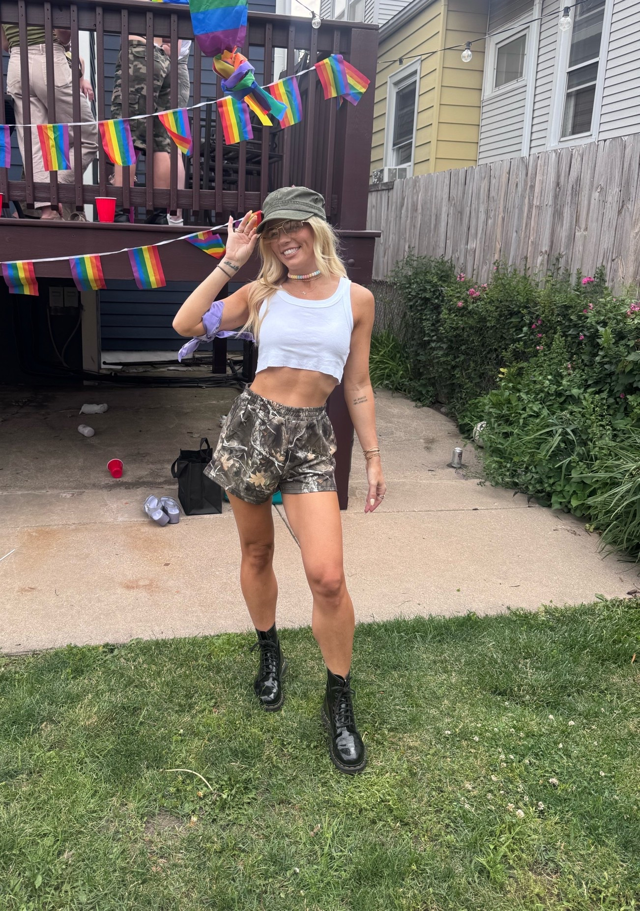 Camo running shorts and crop top with doc martens. Camo party.