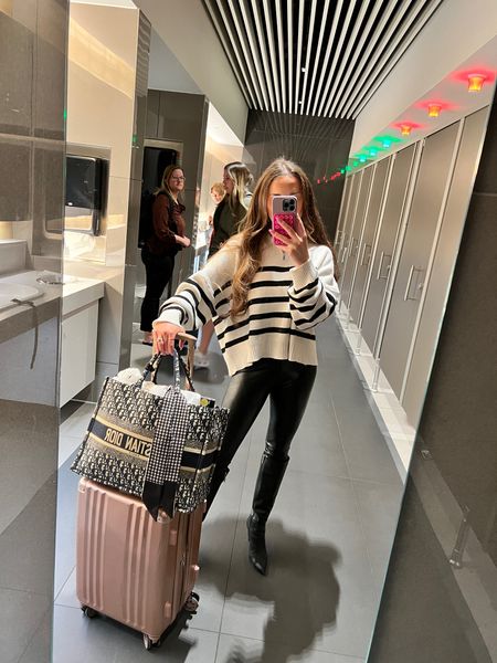 Travel outfit of the day: faux leather leggings, oversized striped sweater, and knee high black boots.

Wearing an XS in leggings and M in sweater for a more oversized fit. 

#LTKtravel #LTKfindsunder100 #LTKstyletip