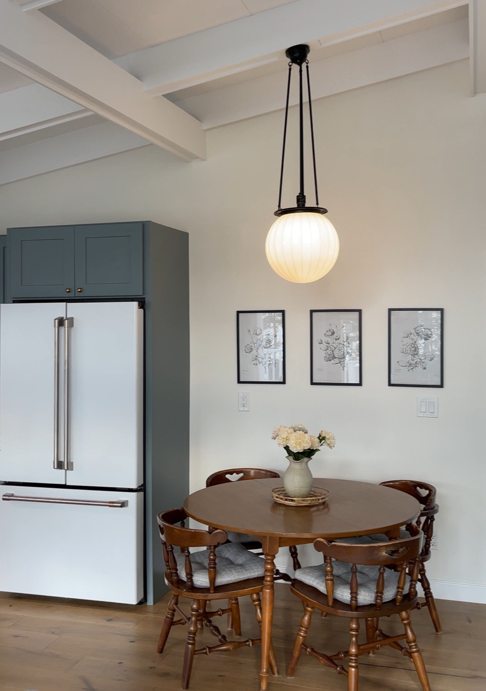 Cottage dining and coffee bar details 

Black antique desk is from FB marketplace :) Picture above coffee bar is from home goods. Dining room table is original to the cottage. 

Rejuvenation, light pendant, fluted globe, floral prints, Etsy, cafe fridge, smeg, pottery barn, sconce, coffee maker, glass containers 

#LTKstyletip #LTKhome #LTKFind