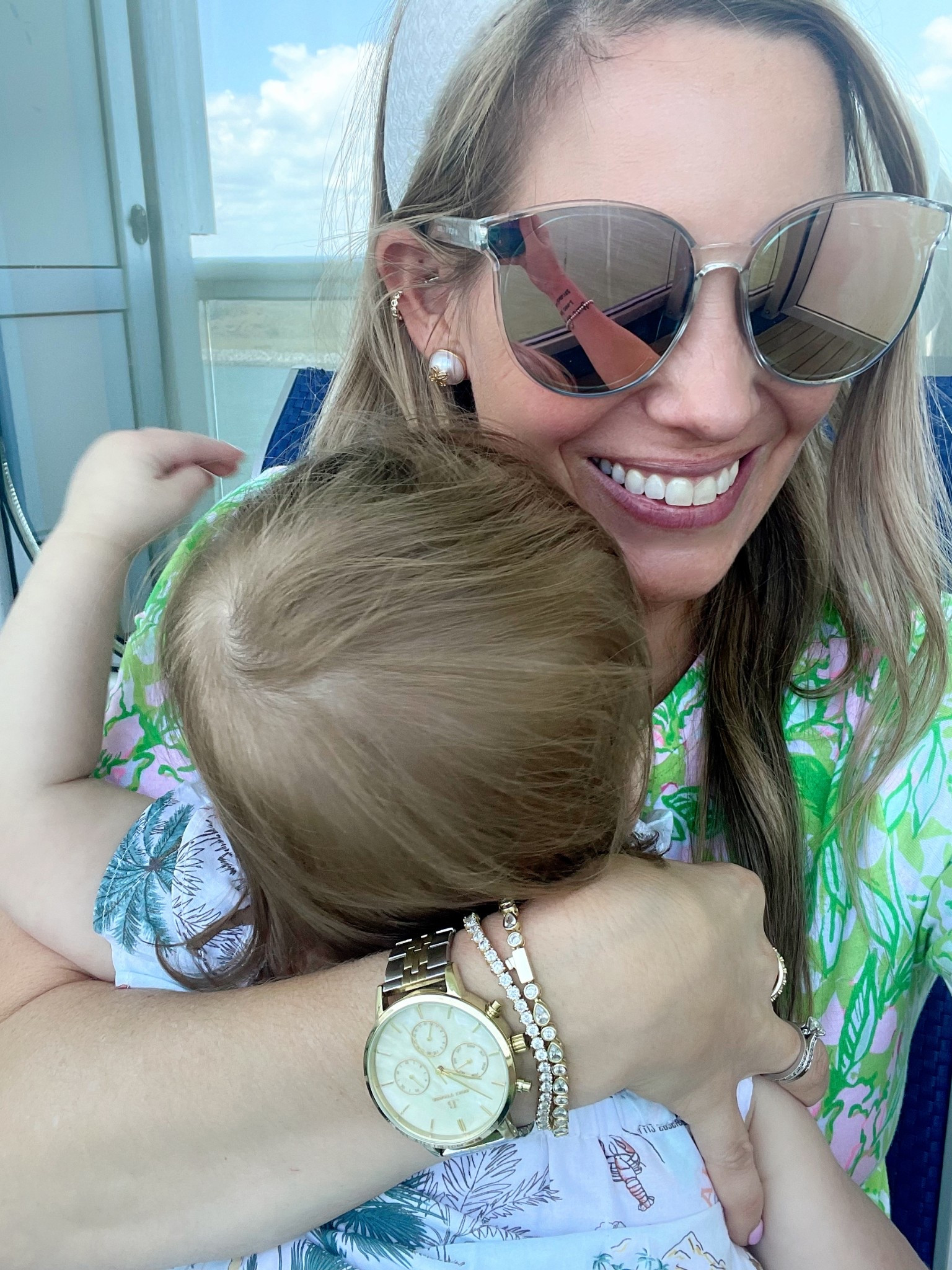 Code ASHLEYBA for 10% off my Melinda Maria jewelry ✨💎

Sweet balcony snuggles at sea 👩‍👧🌊💞 — wearing one of my favorite Lilly Pulitzer prints in a bright, tropical green and pink combo that pops against the ocean breeze 🌴🌸. My accessories kept it classic: oversized mirrored sunglasses, a white textured headband, pearl stud earrings, and sparkling Melinda Maria tennis bracelets stacked with a gold watch 🤍🕶️⏱️.

My baby girl is in a darling tropical animal print dress — perfect for cruising, comfy cuddles, and a mid-day nap in mama’s arms 🐬👶🌺.

Outfit Details:
	•	Top: Lilly Pulitzer pink + green printed top 🌿
	•	Accessories:
• Mirrored sunnies 🕶️
• Pearl studs 🫧
• White textured headband 🎀
• Gold watch + Melinda Maria tennis bracelets (code ASHLEYBA for 10% off!) 💫


Lilly Pulitzer cruise outfit, mommy and me moment, balcony snuggle, tropical cruise fashion, baby girl vacation outfit, Melinda Maria stack, pink and green lilly print

Perfect for:
Cruise balcony time 🚢, tropical vacations 🏝️, spring break outfits 🌸, mommy and me content 👩‍👧, matching family looks 📷

Golden hour glows + tropical hugs = memories that shine!
Shop the look now on LTK 🛍️🌺✨

#LTKFindsUnder50 #LTKOver40 #LTKFindsUnder100