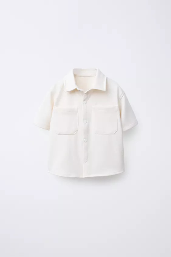 Comfort shirt with collared neck and short sleeves. Front snap button closure. Front patch pocket... | Zara US