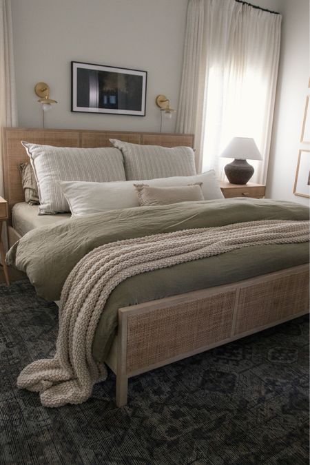 Best sellers for July! My olive linens are always a hit and such a great price for a bundled linen set. My wood and cane bed is back in stock! And another best seller, my natural chunky knit throw! #primarybedroom #organicmodern #livingroom #lightandbright #ltkhome 