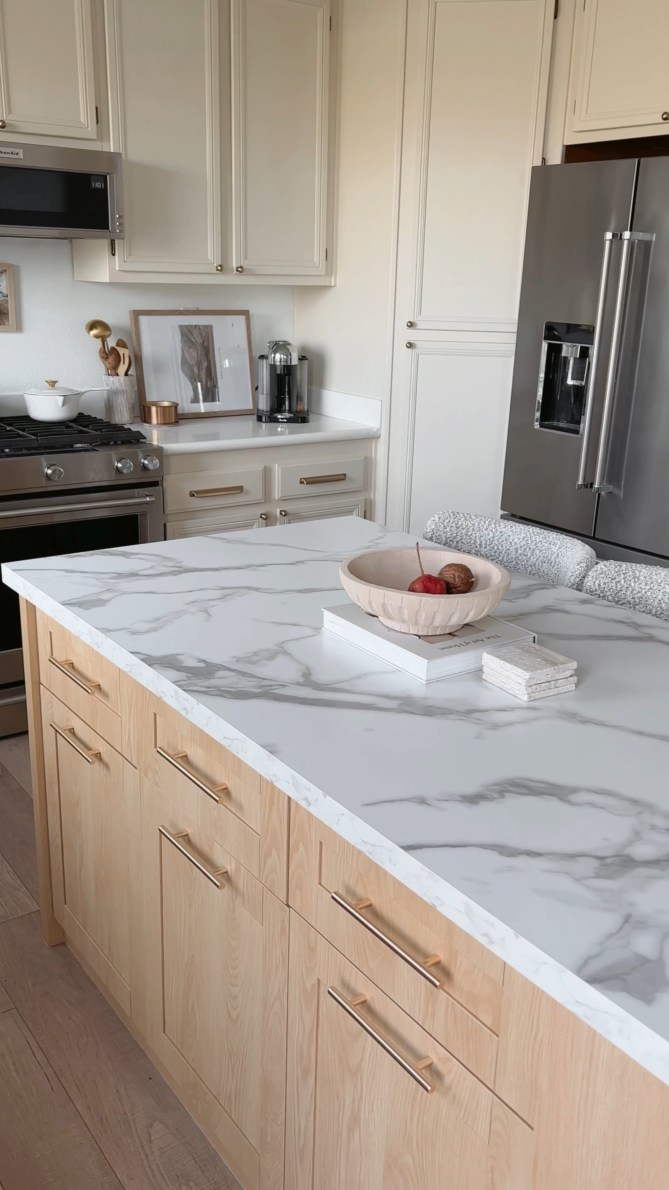 Welcome back to day two of renovating our fugly 2000's kitchen 🤍 Last week, we deep cleaned and painted the cabinets.

Now we're heading into the last step of phase one - replacing our kitchen island! We found this beauty at @homary and it came with a marble-look veneer countertop.

We were already planning on replacing all of our kitchen counters later this year, so we'll update the island as well. I'm thinking a marble-look quartz, and a slab backsplash!

Now we just need to finish installing the drawer pulls (weirdly one of the hardest things l've done - lining up the holes is a pain!) and install the brass faucet I ordered.
find a sneak peek in my "KITCHEN" highlight on IG!

Phase two:
+ find pendant lights & install above island
 + replace all countertops
 + backsplash

What's your favorite part of our kitchen renovation so far?

Are you planning to update your kitchen this year? Let me know in the comments?

#kitchenremodel #kitchendesign #homedesign #kitcheninspiration #homerenovation #homeimprovement #kitchentrends2024 #cabinets #paintedcabinets #appliances #kitchenaid #sherwinwilliams Kitchen remodel on a budget, kitchen remodel ideas, kitchen remodel design, kitchen organization



#LTKstyletip #LTKSpringSale #LTKhome