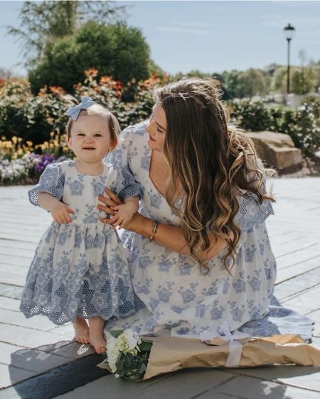 Family photoshoot matching mommy and me. Baby girl mommy and daughter matching dress. 