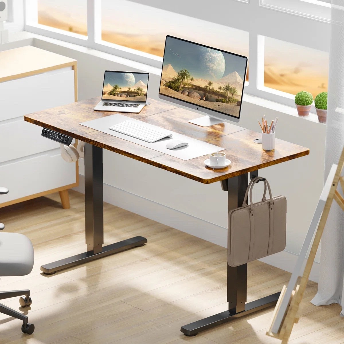 This height-adjustable standing desk from Wayfair is such a smart home office upgrade for creating a more comfortable and productive workspace. The wood desktop and black frame give it a clean modern look while the adjustable height settings make it easy to switch between sitting and standing throughout the day. Love the spacious surface for dual monitors, laptops, and office essentials. Perfect for home offices, remote work setups, gaming spaces, and apartment workstations. Plus, it’s currently on sale.