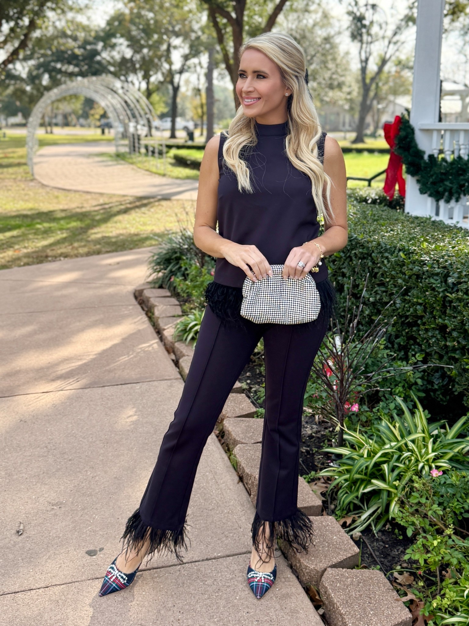 Can we talk about how much I love this look from Draper James? The feathers just make this set pop! They are also detachable for easy washing. Added some holiday flare this outfit with the Christmas plaid heels, holiday charm bracelet, and rhinestone bow. 

#LTKootd #LTKHoliday