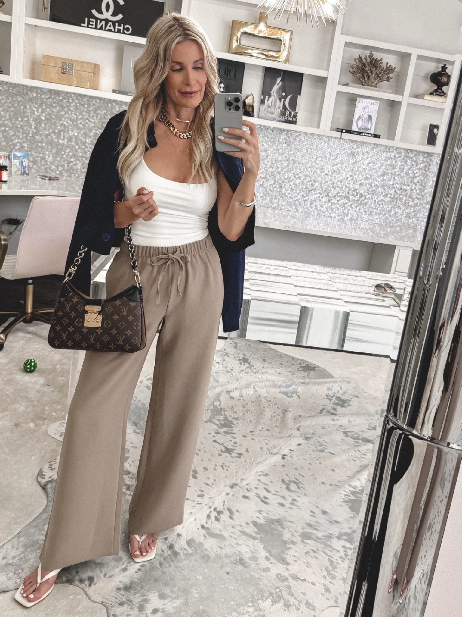 If you’re looking for the perfect combination of chic and comfortable, these pants are it. 🤍

I’m obsessed with the Lodge Pant in taupe. The neutral shade goes with everything, and the wrinkle-free fabric, elastic waist, and pockets make them as practical as they are stylish. Easily one of the most comfortable pairs of pants I’ve worn, yet they look so polished.

I paired them with a white halter top and this fabulous navy jacket for a sophisticated look that’s perfect for everything from lunch with friends to date night, travel, or casual work events.

Everything runs true to size. I’m wearing an XS in the pants, XS in the top, and XS in the jacket.

#LTKootd #LTKgrwm #LTKOver40