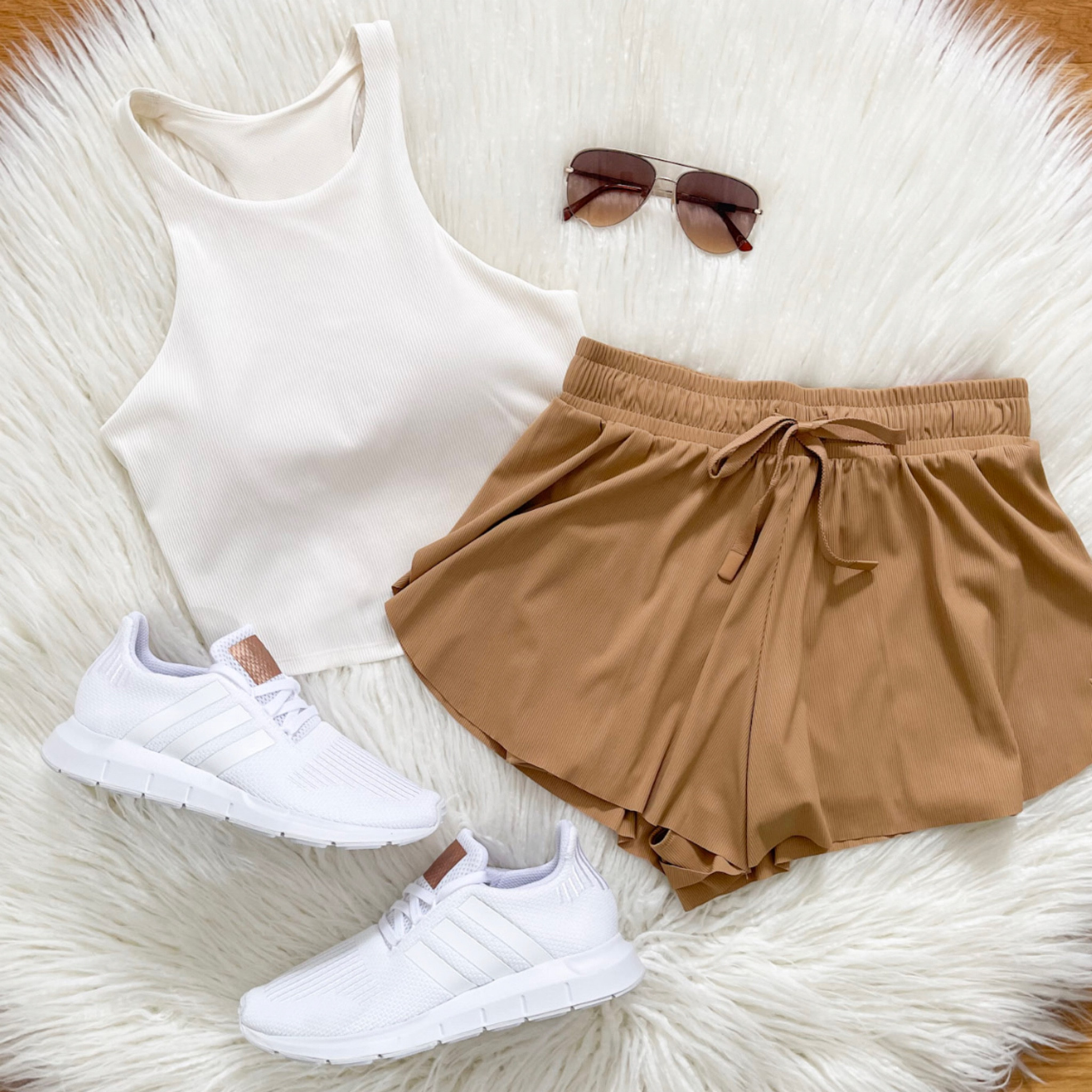 Happy Tuesday!  It’s finally starting to feel like spring here! How about where you live??  Sharing these MUST HAVE double layer JoyLab shorts with you tonight!  They are great quality and love the flow!  Styled it with this favorite Ribbed Seamless Tank (obsessed!!)  Everything here is linked for you! 

#LTKunder50 #LTKstyletip #LTKfit