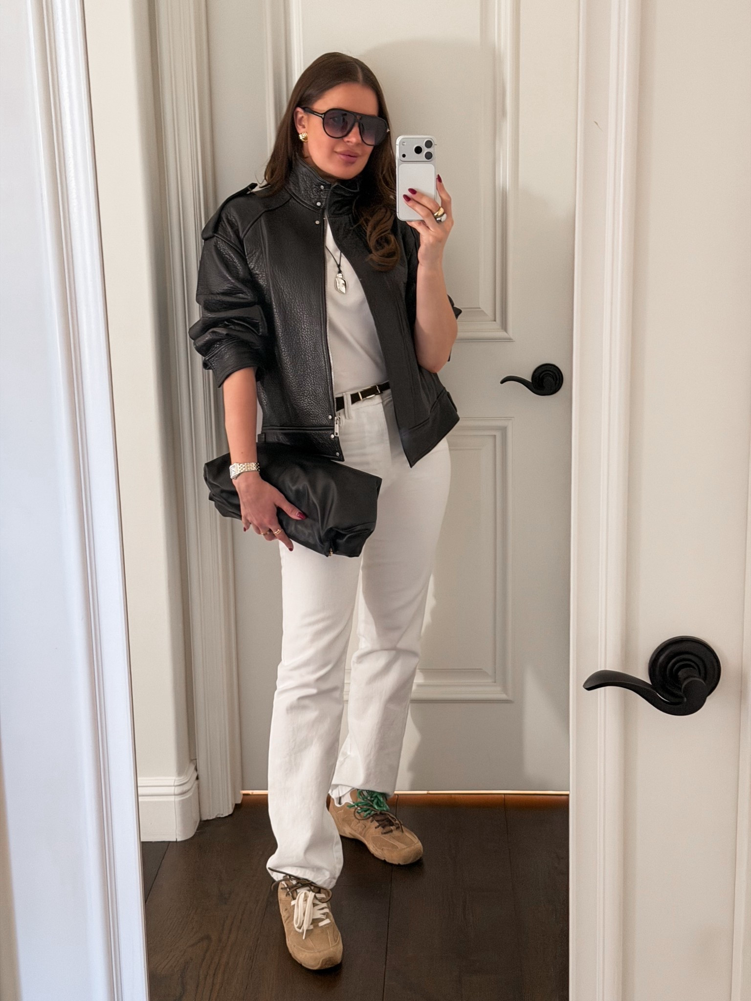 Styling a black leather bomber jacket with white denim pants, suede sneakers and a black leather clutch
#clutch #jeans #straightleg #suede #sneakers #bomber #jacket #leather #aviators #pendant 

#LTKFindsUnder100 #LTKFindsUnder50 #LTKSeasonal
