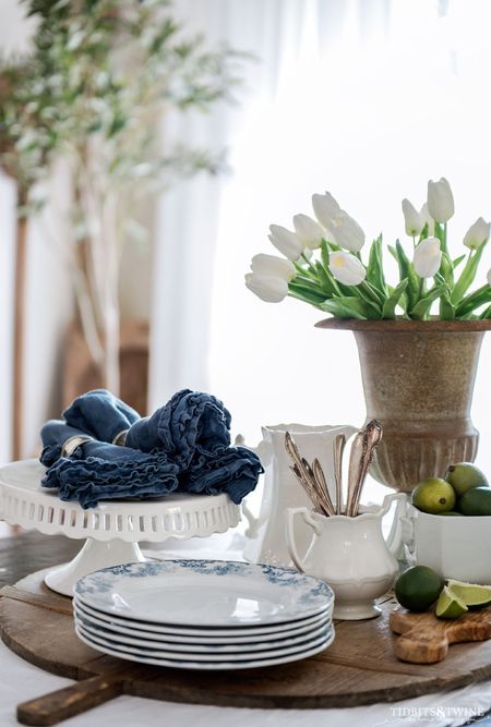 Who’s ready for Sunday brunch?! Well, except these limes are plastic so don’t use them.  But they look good, right?!

Vignette, dining, tablescape, ironstone, transferware, fake tulips, olive tree, fake limes, vintage flatware

#LTKFind #LTKhome #LTKstyletip