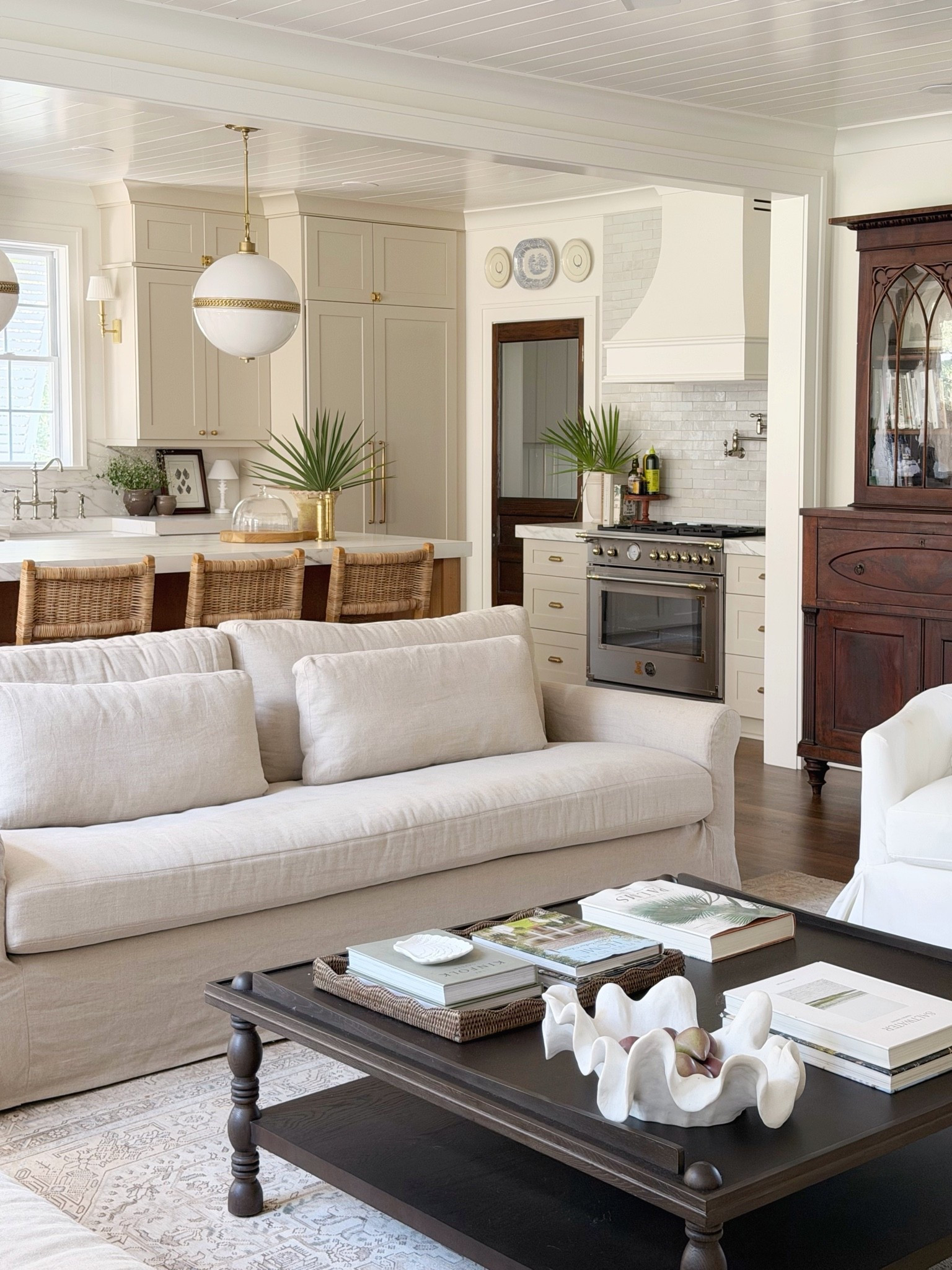 Living room and kitchen design coastal classic collected lighting pendants barstools

#LTKHome