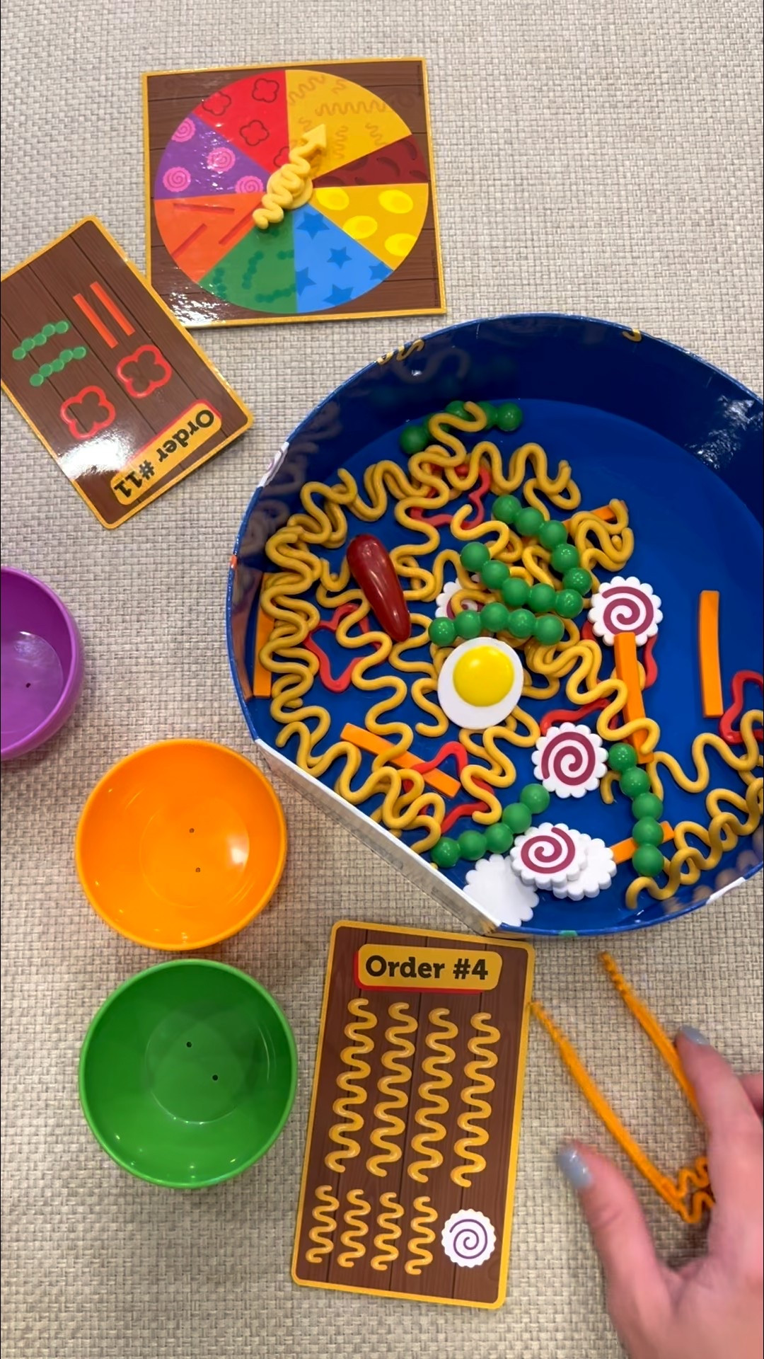 The cutest toddler game! Noodle Knockout from Learning Resources! 🍜 Build a noodle bowl all while learning colors, fine motor skills, math, skills, and more!