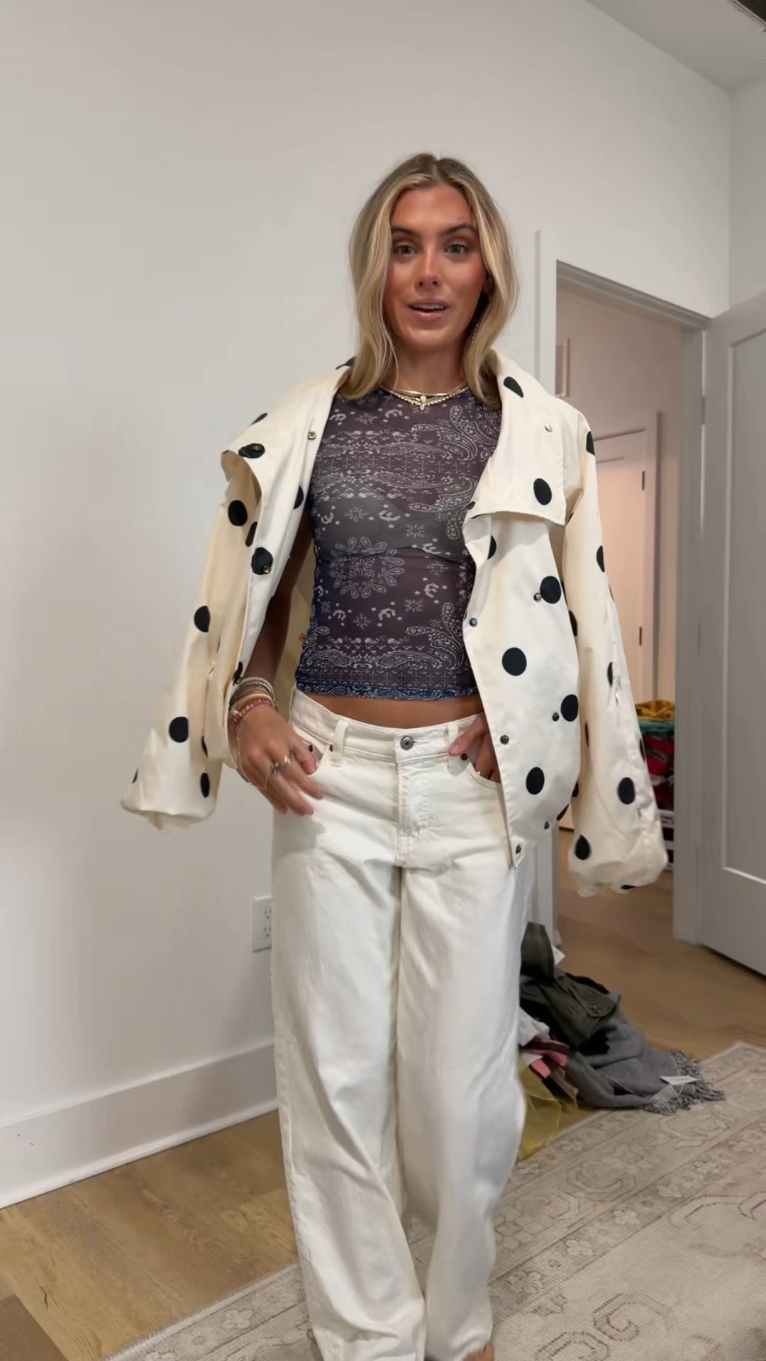 rainy and gross so gotta bring some fun with the outfit I’m wearing my @abercrombie low rise loose white jeans paired with my new @renttherunway miaou mesh short sleeve tee (code RTRXSVOSEN50) with the skims wireless bra and my polka dot amazon windbreaker jacket