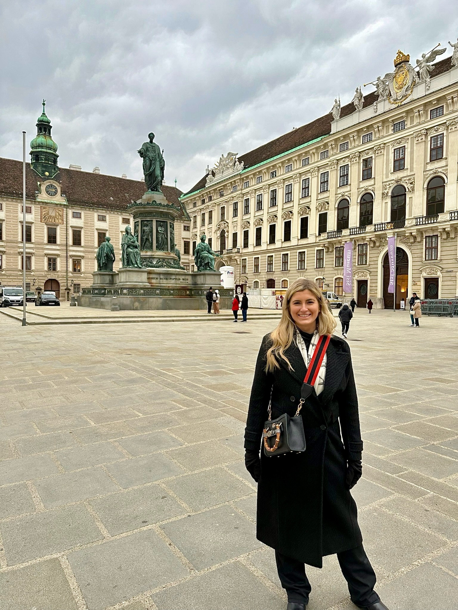 Vienna - Long black trench coat from Avec Les Files. Can be worn up or down. This is worn down during the day walking the streets of Vienna. At night I paired it with a black pair of heels and nicer top underneath.

#LTKtravel #LTKSeasonal #LTKstyletip