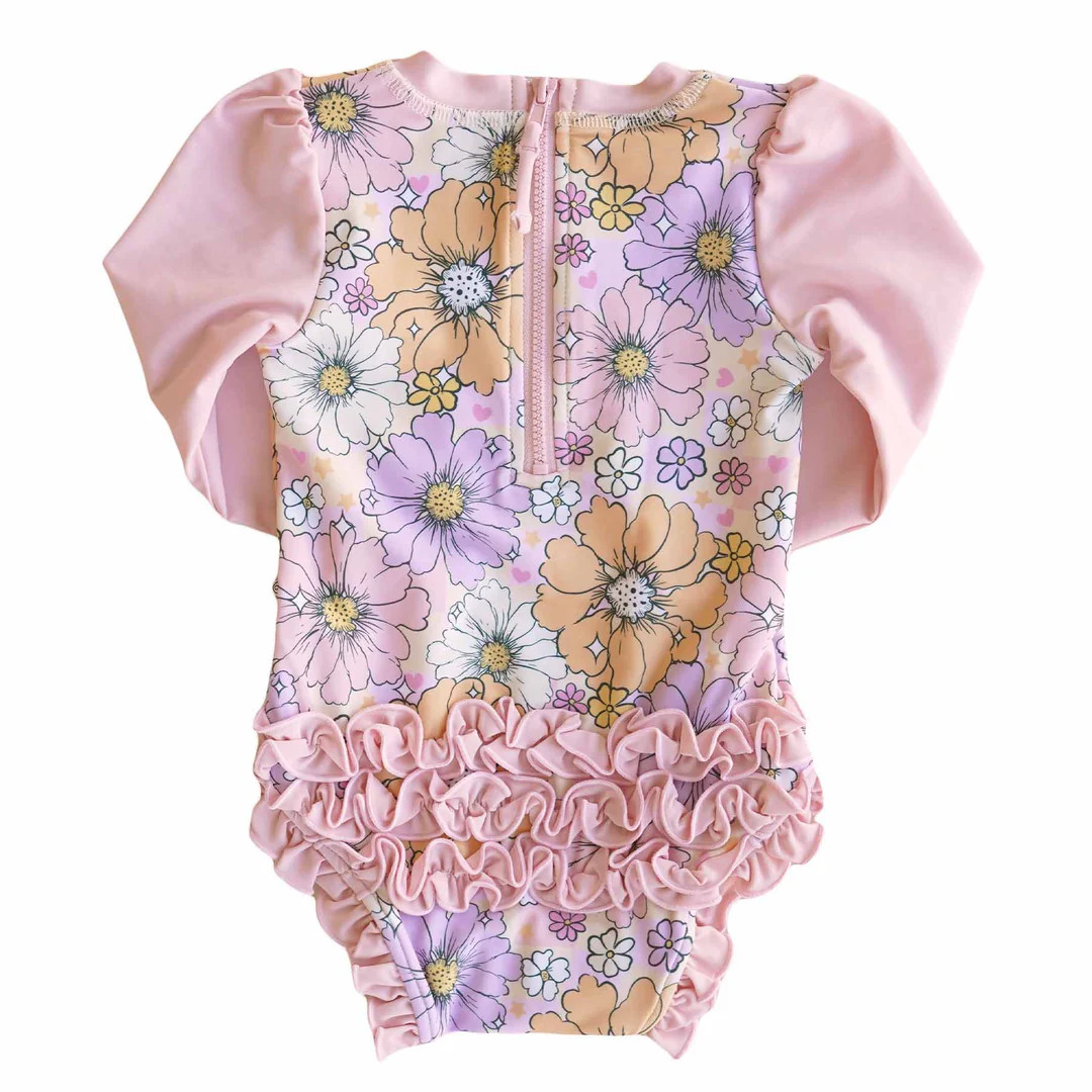 Long Sleeve Rash Guard With Ruffle Bottom | Disco Daisies | Caden Lane
