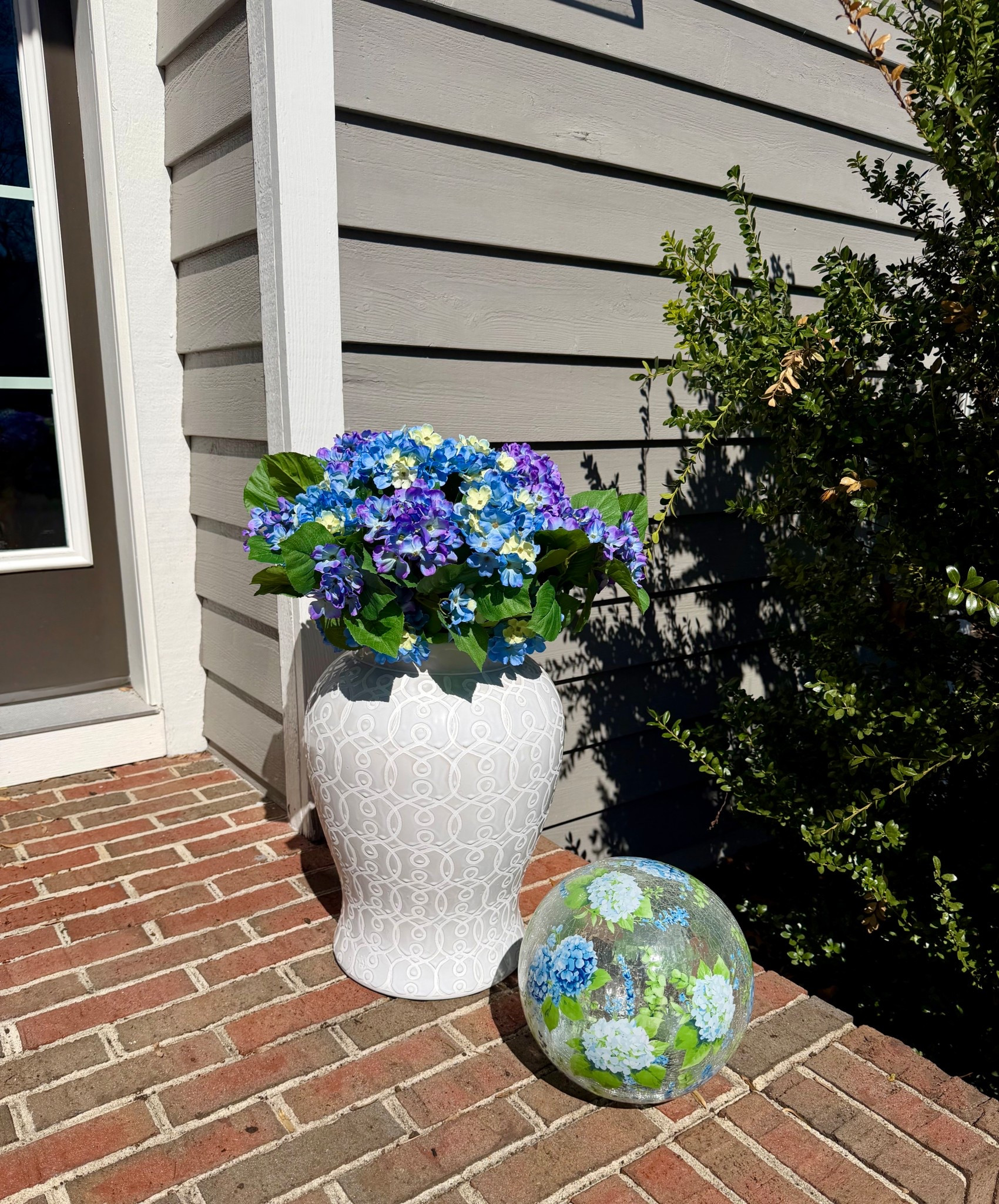 Spring decor starts right at your front door 💙 My Crackle Glass Gazing Ball adds the prettiest pop of spring all day long and it gives off the most beautiful glow once the sun goes down. It’s sold as a set of two, pairs effortlessly with flowers or planters, and comes in Hydrangea, Multi Critter, and Summer Shells to bring a little extra charm to your space ✨

#LTKHome #LTKSeasonal