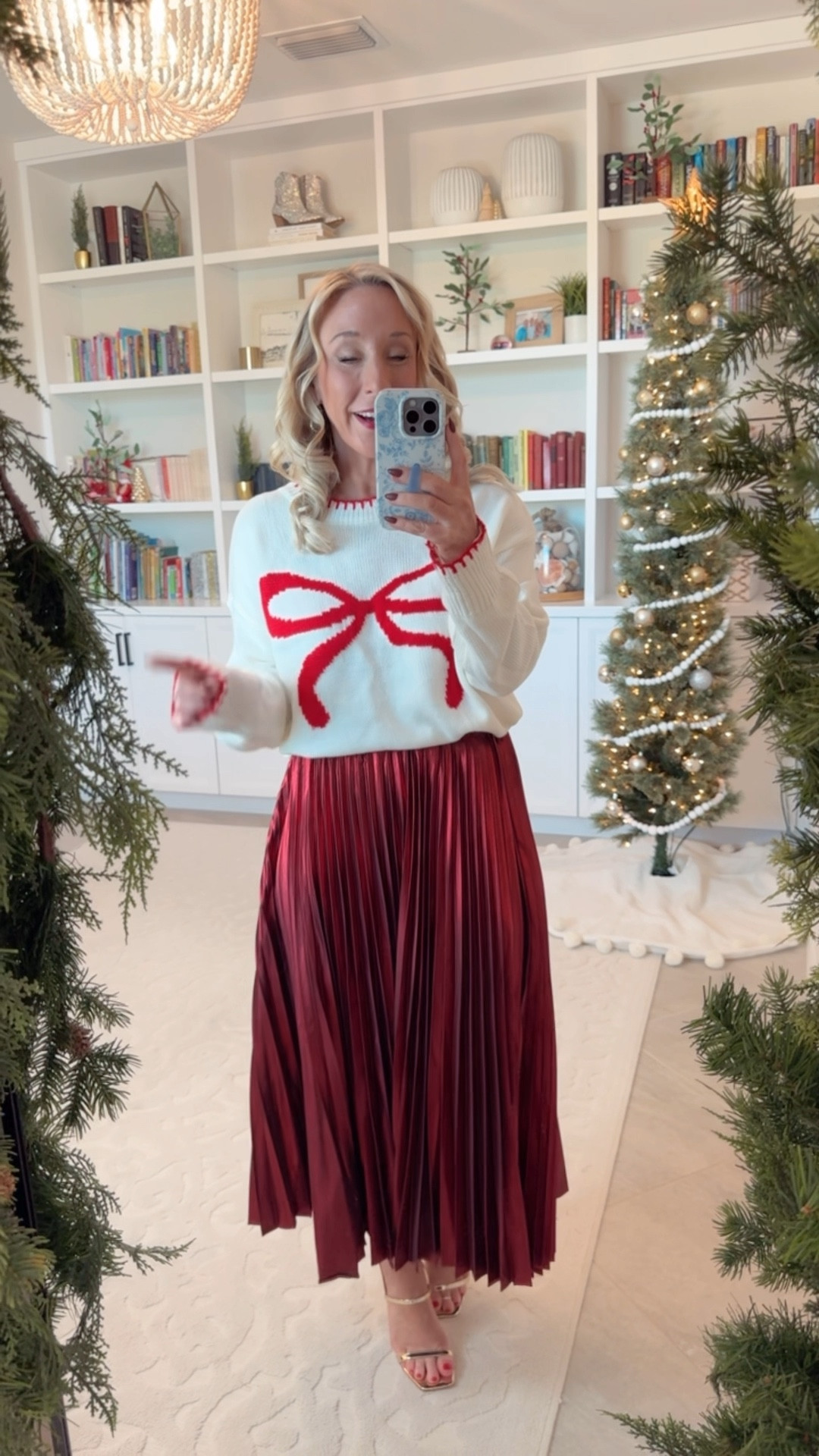 Bow sweater - size small  // red metallic skirt - size XS (not from Amazon),
• gold heels - tts. 

#LTKHoliday #LTKSeasonal #LTKWatchNow