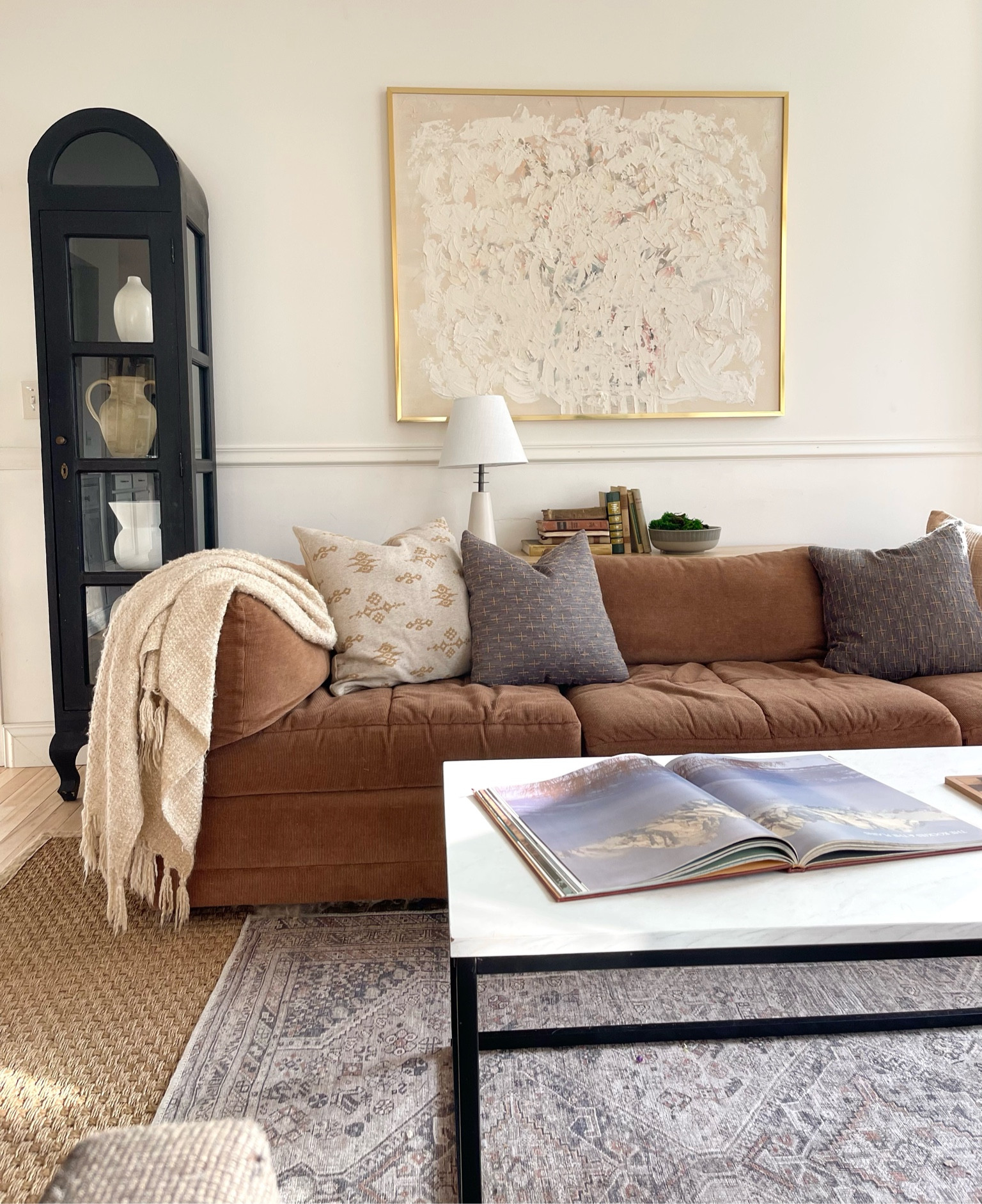 Organic modern family room, neutral home, pillow covers, end table, black curio cabinet, white lamp.

#LTKFindsUnder100 #LTKHome #LTKFindsUnder50