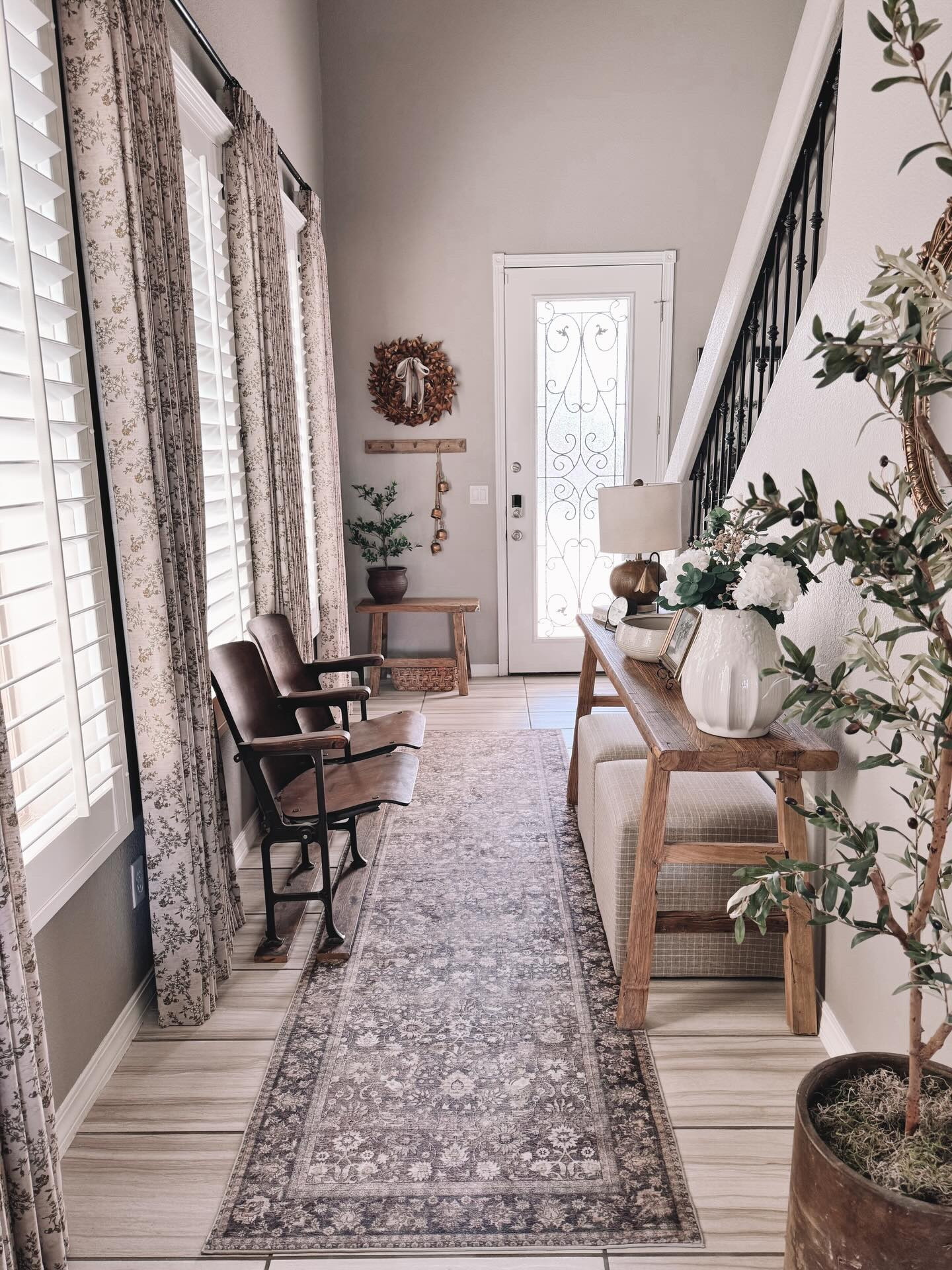 A sweet and calming welcoming. A drop zone and a space to hold extra seating. Creating spaces that are both beautiful and functional are my top priority when decorating our small home. Sometimes it can be tricky but after living in a large home, I know that I will always choose a smaller one now. 
They have a cozier feel and are so much easier to keep clean and decorate! What about you? Do you prefer a larger home over a small one?