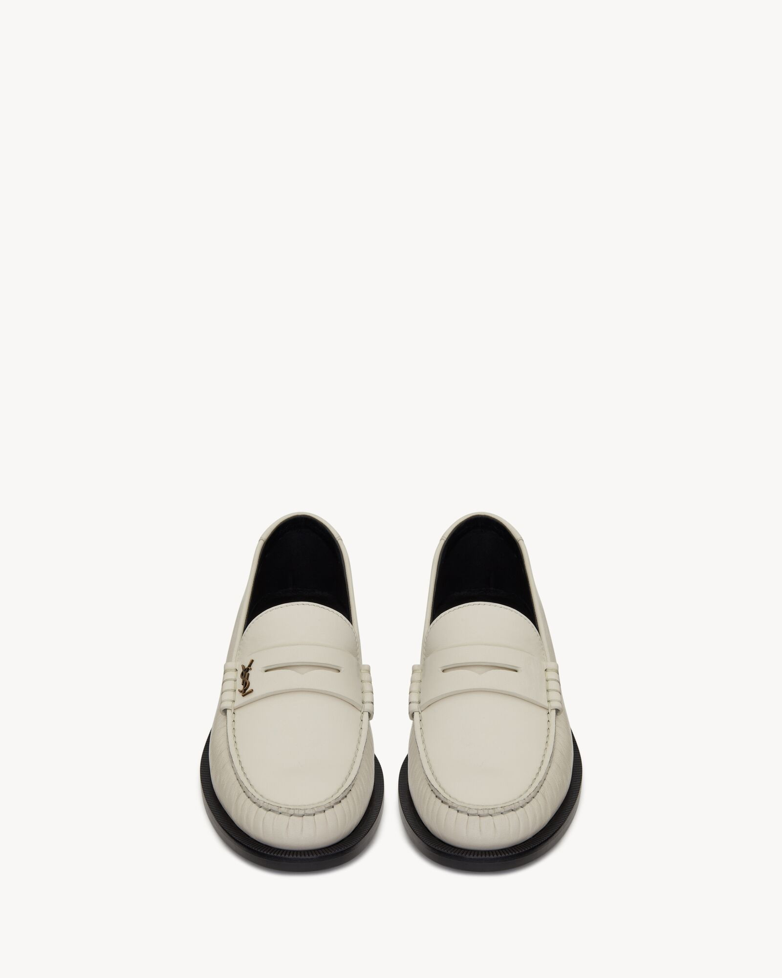 penny loafers WITH LEATHER SOLE, DECORATED WITH THE CASSANDRE and featuring a saint laurent embos... | Saint Laurent Inc. (Global)