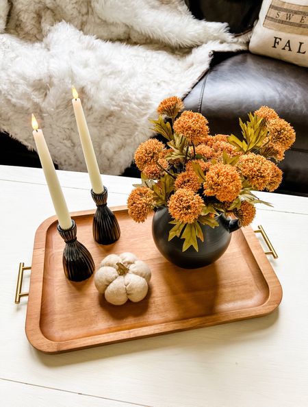 Seasonal fall coffee table tray with battery operated candles which work on a remote 🖤 

Black vase, fall florals, wooden tray, black candle holders , pumpkins, faux fur blankets 

#LTKSeasonal #LTKhome #LTKHalloween