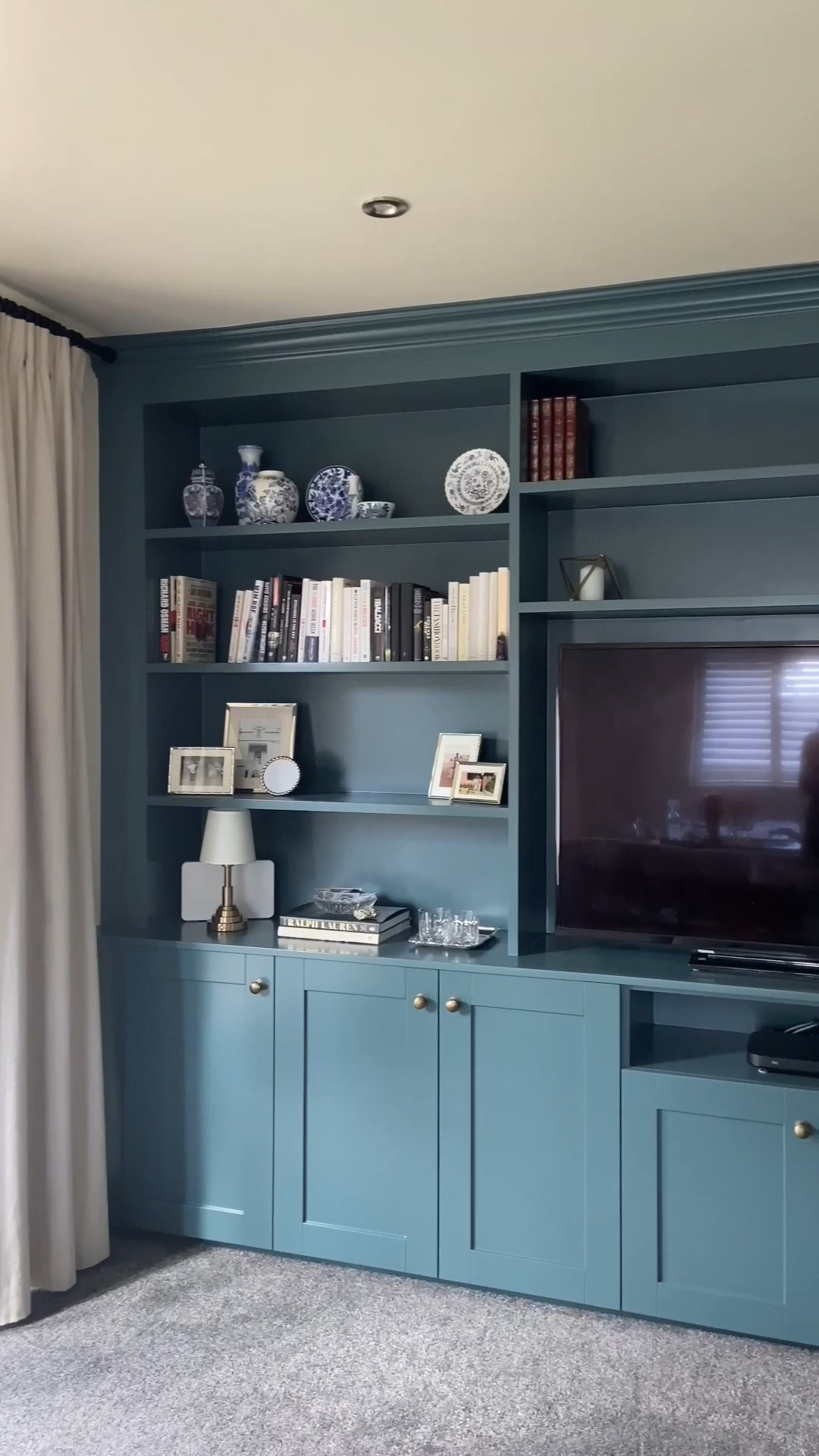 From Blank Wall To Ralph Lauren Living Room Vibes 🐎🌳📗 This media wall transformation turned an empty, lifeless wall into a timeless built-in with tons of storage, warmth, and that Ralph Lauren living room elegance. 

#LTKHome #LTKOver40 #LTKSeasonal