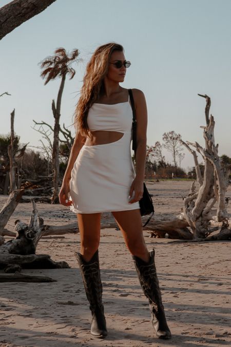 Cute little white satin cutout mini dress 

Bachelorette
Bride to be 
Coastal cowgirl 
Coastal Cowboy 
Black western boots 
Cowgirl boots 
Festival outfit 

#LTKFestival #LTKunder100 #LTKstyletip