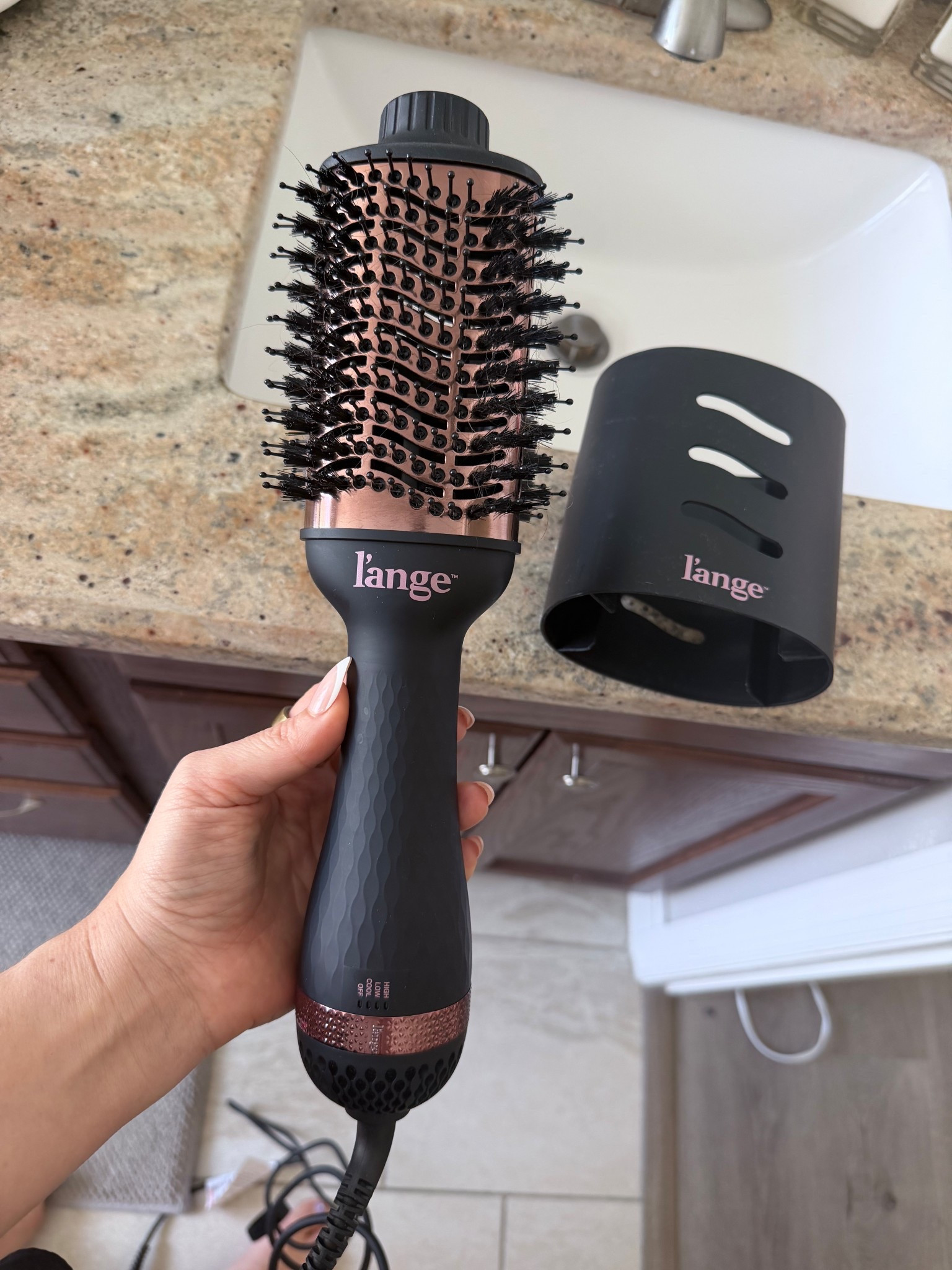 My favvv hair dryer is 30% off! I love how gentle it is on my hair and how fast and smooth it dries it! I do it in small sections with hair my length it takes 15-20 min max! Plus comes with this little cover to keep the bristles from bending when you travel/store it! LOVE my #lange 

#LTKHoliday #LTKSaleAlert #LTKgrwm