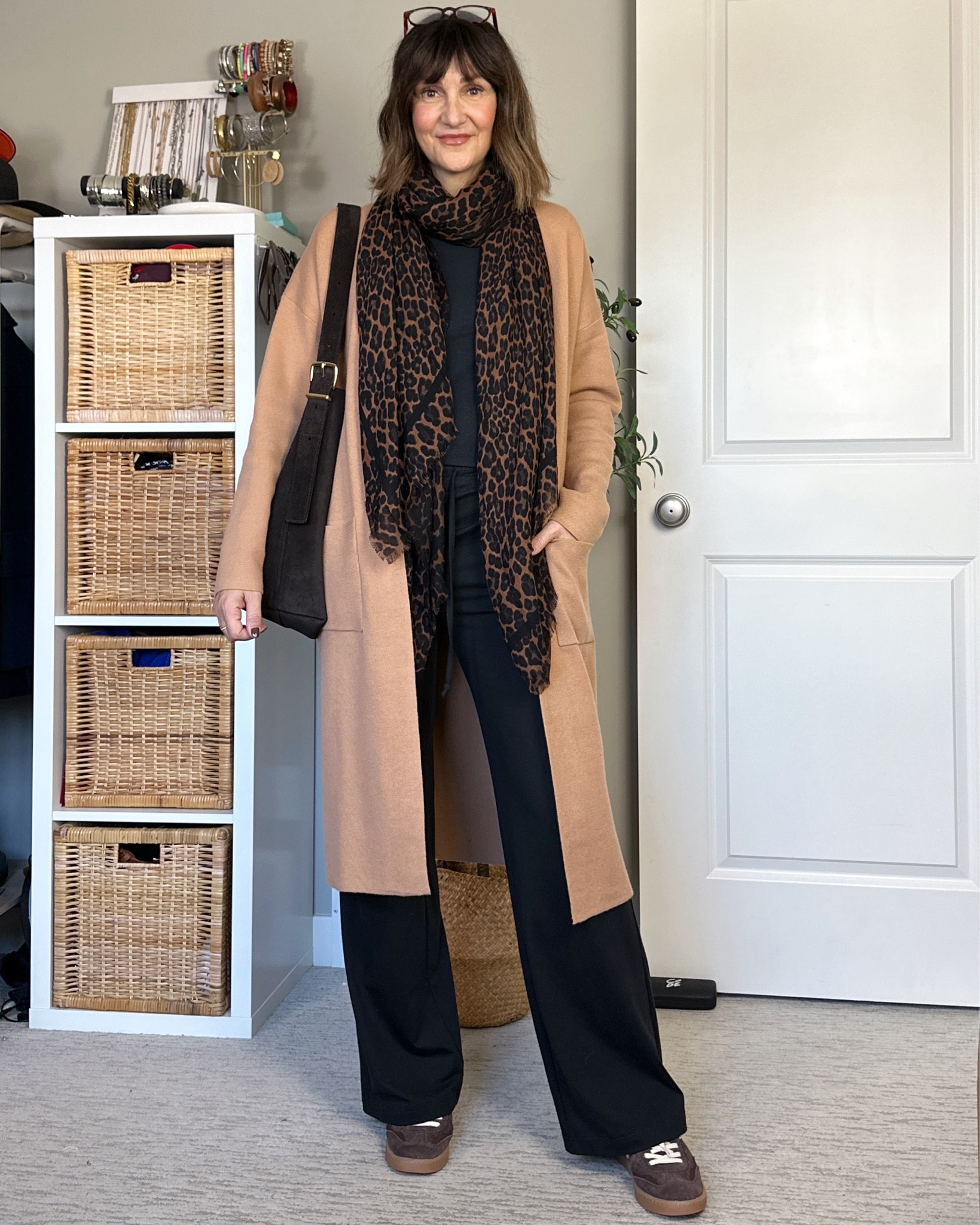 Casual but polished fall outfit. The base is just a black tee and lounge pants (wearing S in both) and I added my fave long cardigan, it’s a structured knit but very soft, I get M for more room and sleeve length. 
A leopard scarf, brown suede sneakers (tts) and a brown suede bag adds interest and color
Also linked my fave crew socks and the Converse I had on at the beginning, they fit big, go down 1/2 size.

#LTKShoeCrush #LTKItBag #LTKStyleTip