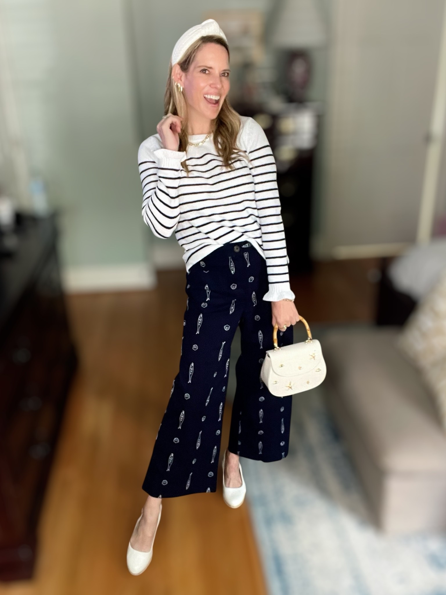 ⛵️ COASTAL CUTE & CLASSIC ⛵️
Use code PREPPYREBEL for 10% off my Melinda Maria jewelry! 💫

This outfit is giving major modern nautical vibes with a preppy twist! I’m pairing a lightweight striped sweater with these navy wide-leg pants covered in the cutest embroidered seashell and oar motifs. The combo is comfy but elevated, perfect for transitional weather or breezy beach town strolls! 🌊

🧵 Striped lightweight sweater – classic & versatile
🌊 Navy embroidered wide-leg pants – fun coastal prints
👜 White mini bag with gold starfish accents
👑 White textured headband + pearl Melinda Maria hoops (use PREPPYREBEL for 10% off!)
👠 Ivory flats – comfortable & timeless
📏 Pants fit TTS – wearing size XS

This look feels polished yet playful—ideal for a coastal weekend or casual dinner al fresco 🌞

#coastalstyle #preppyrebelstyle #nauticalfashion #melindamariajewelry #ltkunder100 #classicstyle #stripedtop #summerstyle #preppylook #seashellstyle 🌟

#LTKOver40 #LTKFindsUnder100 #LTKFindsUnder50