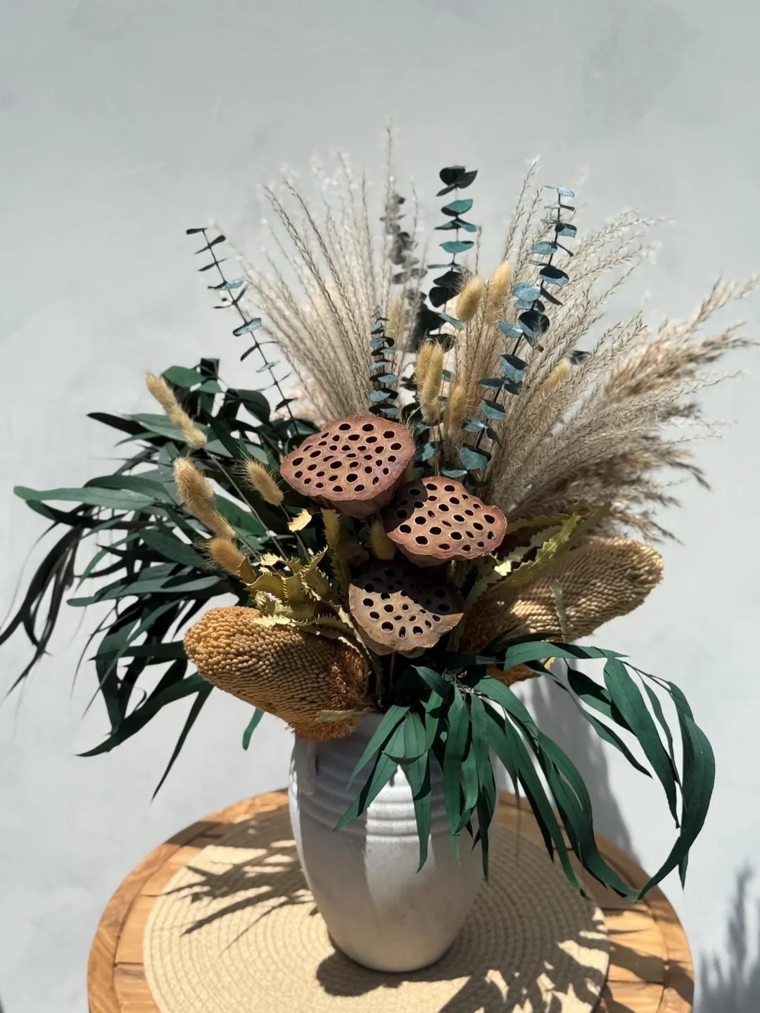 Let nature set the tone with the Whispering Dune dried flower arrangement by EverdriedBloom. Featuring sculptural banksia, airy pampas grass, eucalyptus, lotus, and soft bunny tails, this neutral bouquet brings effortless calm and organic texture to any space. Designed to be admired from three sides and available with or without a ceramic vase, it’s a timeless, maintenance-free accent perfect for shelves, tables, or thoughtful gifting.

#LTKhome #EtsyFinds #DriedFlowers #NaturalHomeDecor #NeutralDecor #RusticStyle #BohoHome #EverlastingFlorals #HandcraftedDecor #CottagecoreHome

#LTKHome #LTKWedding #LTKSeasonal