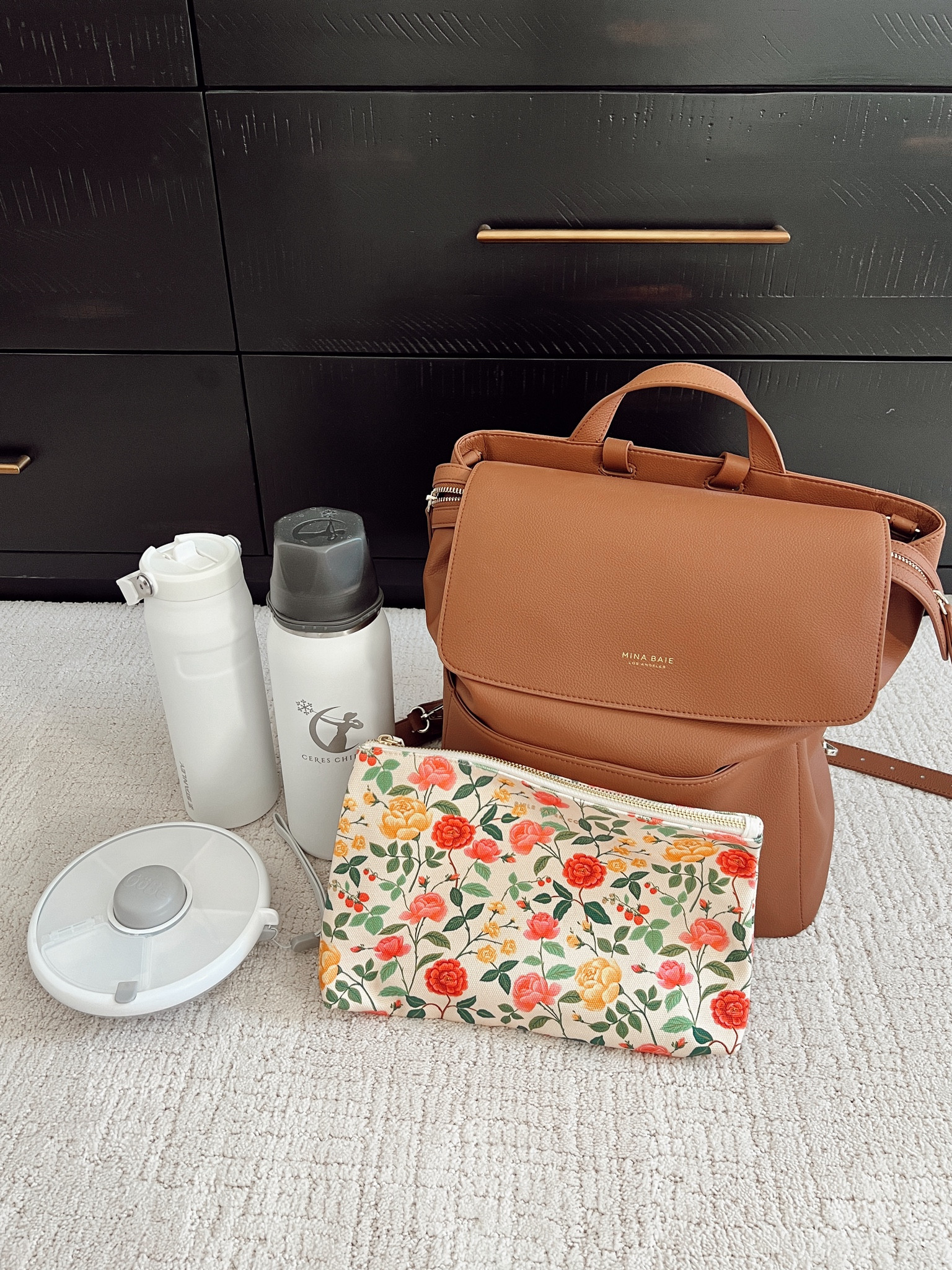 Diaper bag travel items I’m bringing on my solo trip with baby girl. So far I love this faux leather diaper bag because it looks elevated and has lots of compartments on the inside to keep things organized. Bringing my Ceres Chill tumbler to store Breastmilk, snack box for baby girl, zippered pouches for extra clothes and more. 

#LTKBaby #LTKFamily #LTKTravel