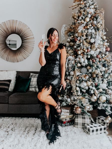 Sequin & feather formal dress! Prettiest Long party dress — perfect for winter wedding, holiday party, or New Year’s Eve! ✨🖤✨
Wearing size small.

Sequin dress
Long dress 
Formal gown 

#LTKwedding #LTKfindsunder100 #LTKHoliday