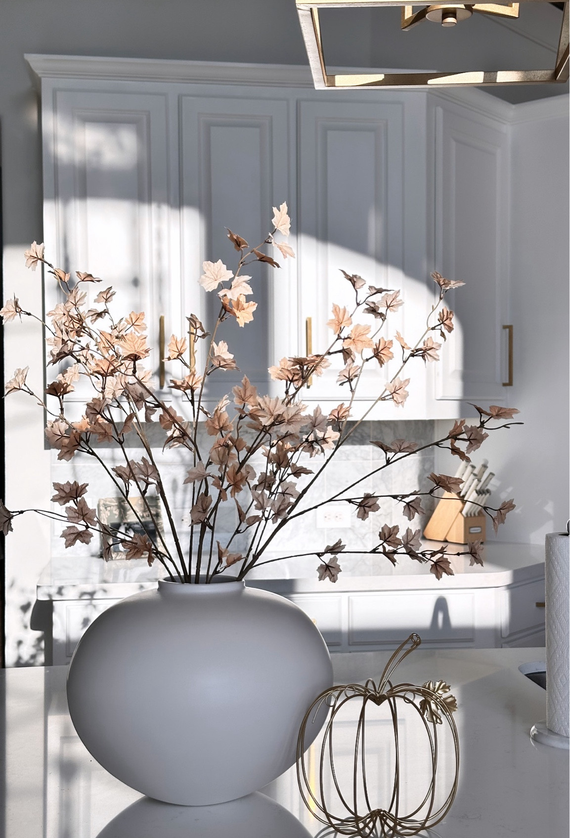 A small touch of Fall decor to refresh our kitchen island. The gold wire pumpkin is from Hobby Lobby and my exact vase is no longer available but found a similar style. 

Fall decor, home decor, neutral home, Fall home decor, kitchen decor 

#LTKFindsUnder50 #LTKFamily #LTKHome