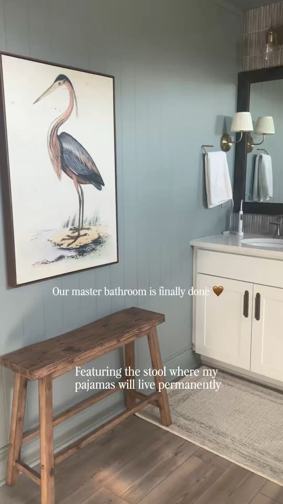 We finally gave our builder-grade master bathroom the warm, cozy update we’ve wanted for so long 🤎

We added wood walls, paint, gold hardware, warmer lighting, and tons of natural wood elements to make it feel more custom and collected instead of cold and builder basic. It honestly changed the entire feel of the space without doing a full renovation.

Also featured in this bathroom:
• the stool where my pajamas live permanently
• an 8-foot mirror frame secured with adhesive and prayers
• “designer” hardware you’d never guess came from Temu
• my first tile job (please don’t zoom in)
• and a speaker big enough for a nightclub because my husband apparently needs surround sound to brush his teeth 😂

The funniest part is my husband ended up loving the wood walls so much that now he wants to do the gym too.

I linked everything I could find — hardware, lighting, paint colors, decor, wood wall details, mirrors, and more 🤎

#masterbathroom #bathroomupdate #buildergrade #cozyhome #bathroomdesign #homedecor #diyhomeprojects

#LTKHome