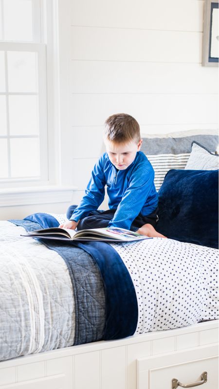 Coastal style shared boys room with pottery barn storage beds, blue and white bedding and more nautical themed bedroom decor for kids room

#LTKkids #LTKfamily #LTKhome