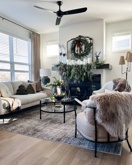 I used lots of holiday greenery, faux fur throws, a cozy rug and fun chair for my holiday living room  

#LTKhome #LTKHoliday #LTKSeasonal