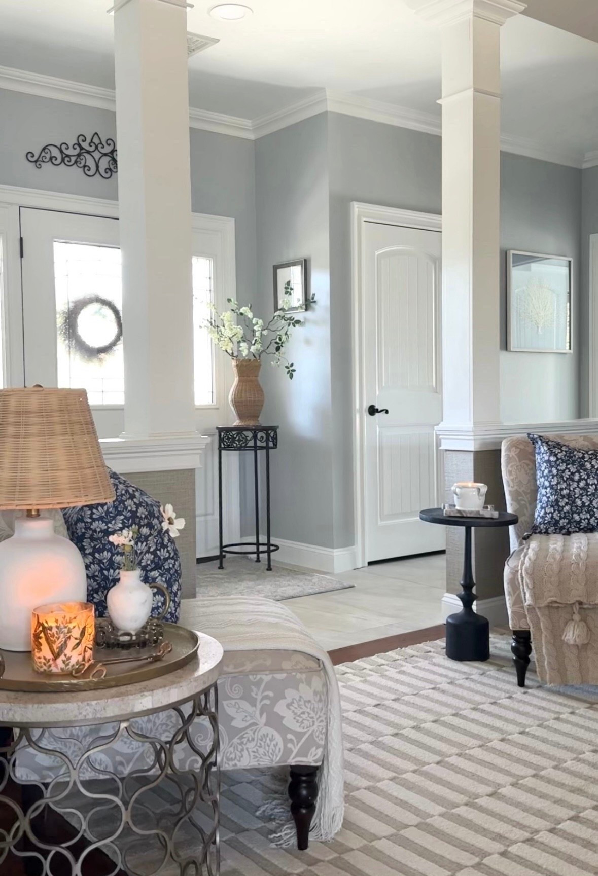 Entryway spring styling. Shop neutral rug, blue throw pillows, blankets, candles, rattan vase, florals and more! Amazon home, Target, Wayfair, Pottery Barn. 

#LTKHome #LTKSaleAlert