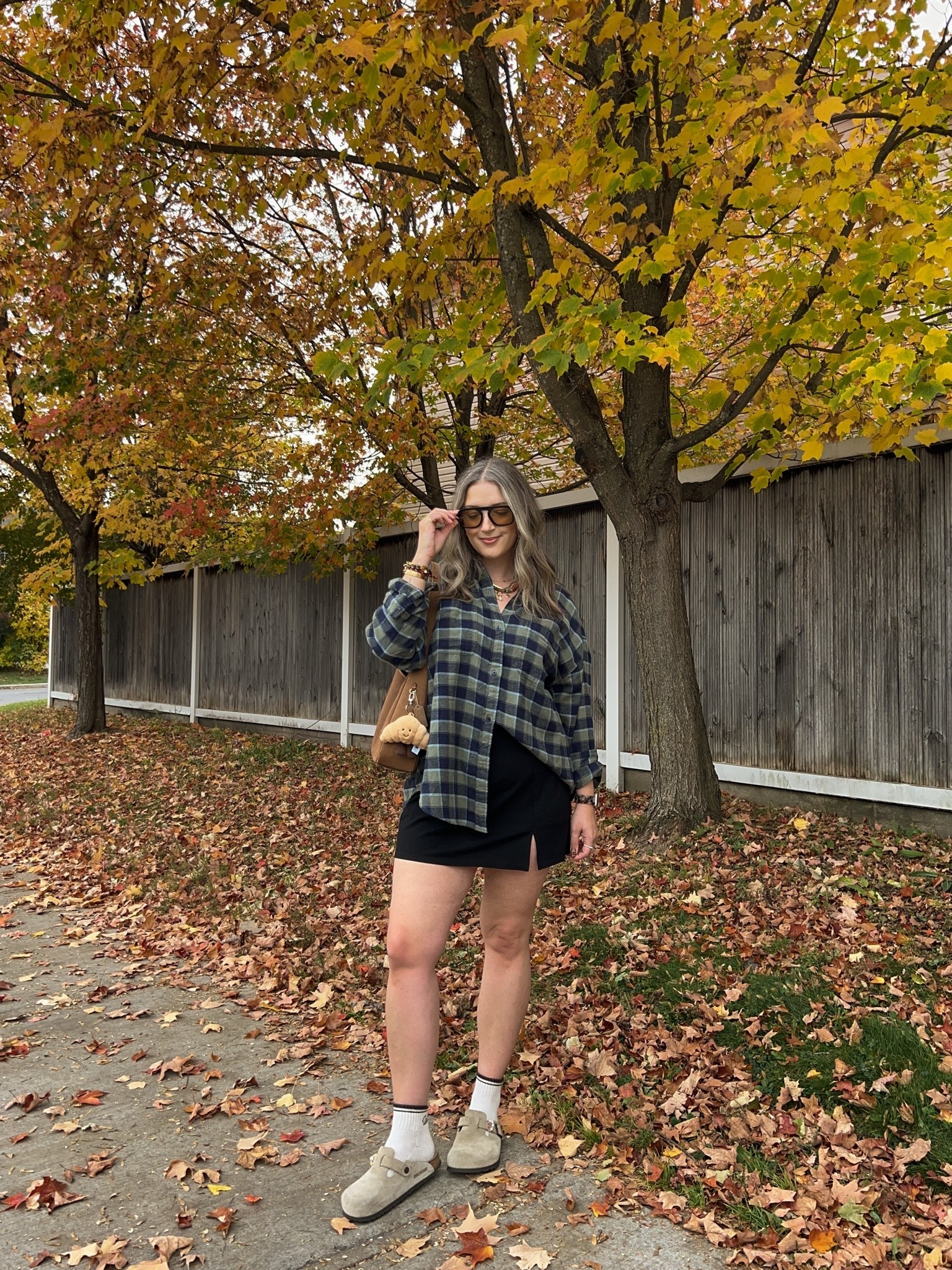 Casual fall outfit! Wearing M in the plaid flannel shirt and L in the black mini skirt (has built in shorts!) I’m a 9.5-10 shoe and wear a 40 in the Birkenstocks