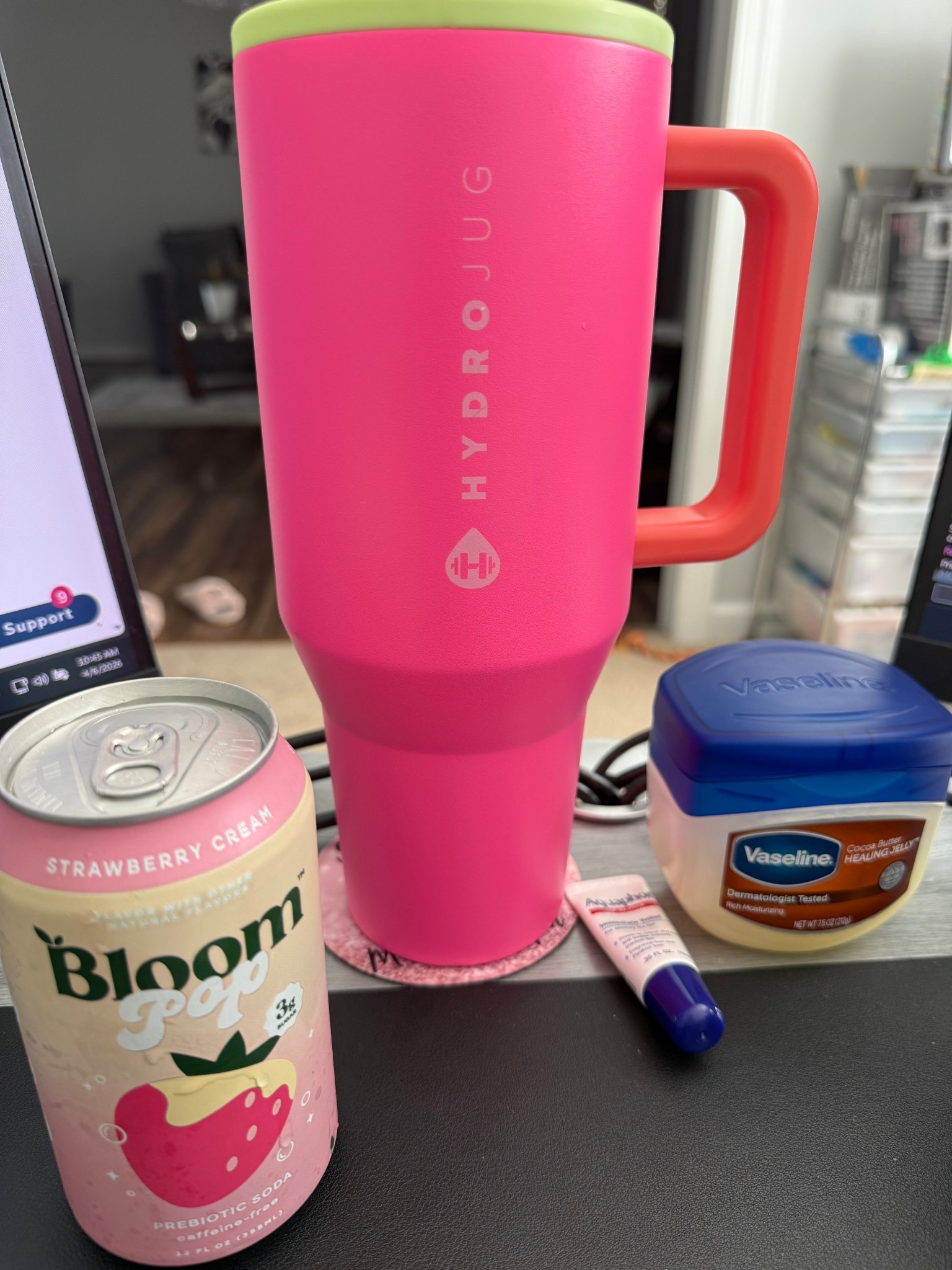 Today's work day was fueled by a tall cup of water, a Bloom prebiotic drink, and lip options. The skin feels dry while taking Accutane, so hydration is key. Has anyone tried the Strawberry Cream Prebiotic Bloom drink? If so, what are your thoughts? I think it's deliciously packed with good stuff and very little sugar. #bloom #hydrojug #vaseline #aquaphor

#LTKdayinmylife #LTKU #LTKHome