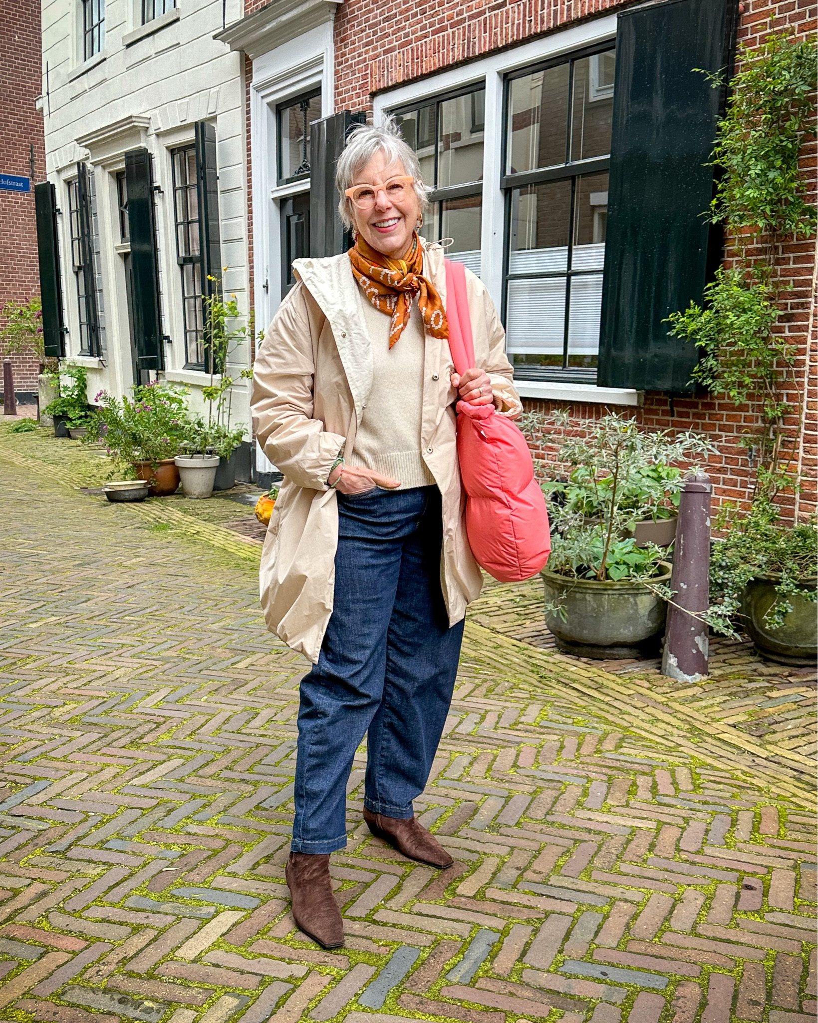 Travel outfit from rainy, windy Netherlands! I’m so glad I packed a rain jacket with a hood! 

That pink bag is keeping my leather purse dry  

#LTKSeasonal #LTKover40 #LTKtravel