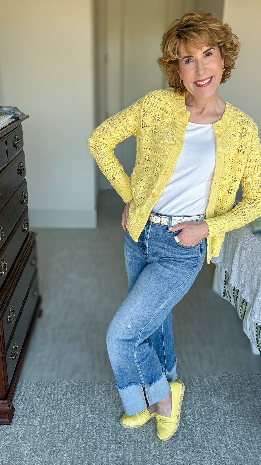 An easy, pulled-together look featuring an on-trend open stitch cardigan layered over a white tank and paired with comfy cuffed jeans. The cardigan adds just the right amount of texture and polish, while the jeans keep it casual and wearable for everyday.

#LTKOver40 #LTKSeasonal #LTKootd