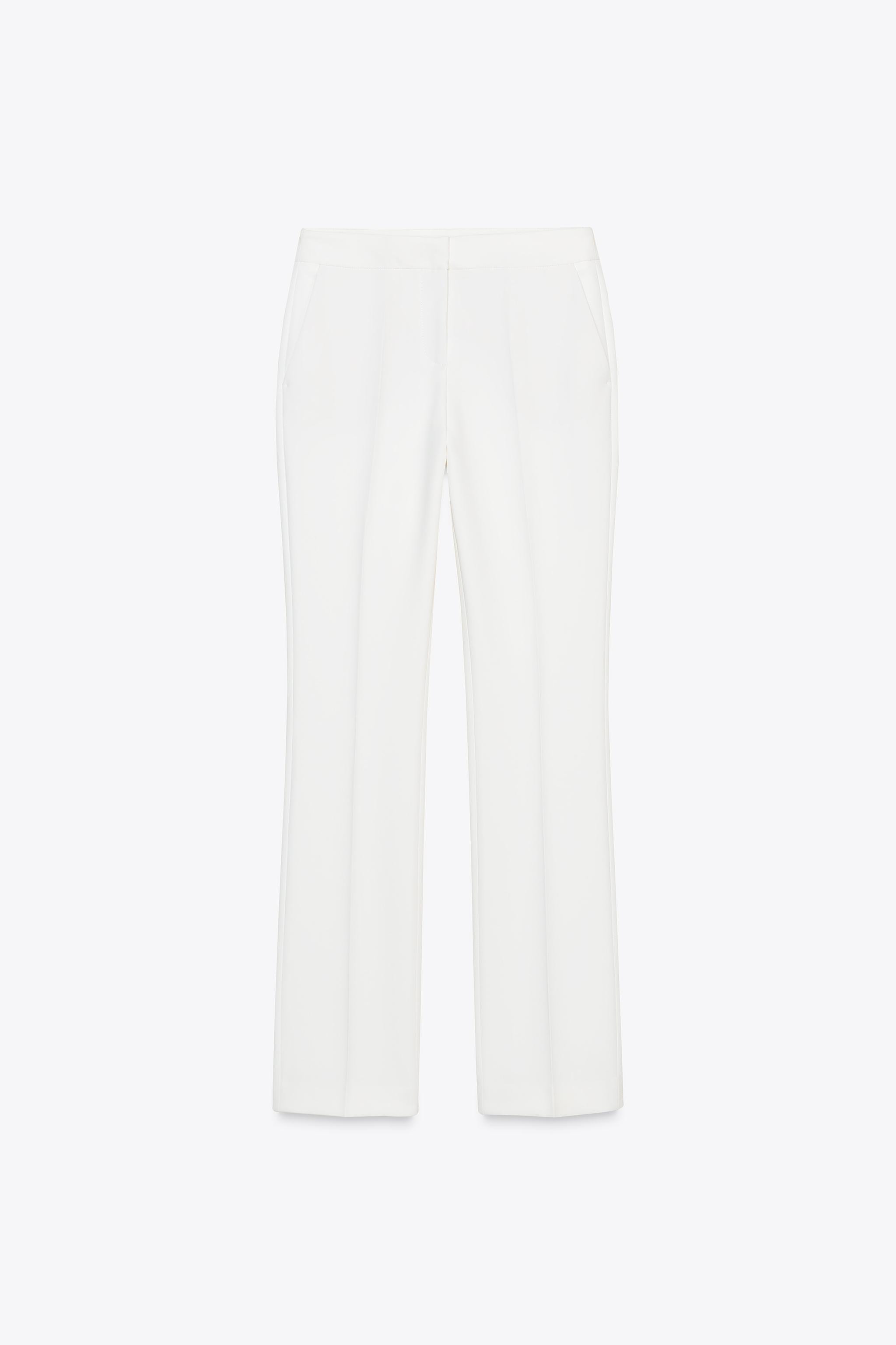 High-waist trousers with front pockets and false welt back pockets. Straight leg. Zip fly with in... | Zara UK