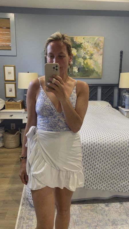 The perfect blue and white swimsuit. Runs tts. Flattering ruching, full coverage, adjustable straps, padded top. A grandmillennial dream! Swim skirt is Amazon and I’ve loved them for years. Code STRIPES30 for 30% off the art over the bed.

#LTKswim #LTKstyletip