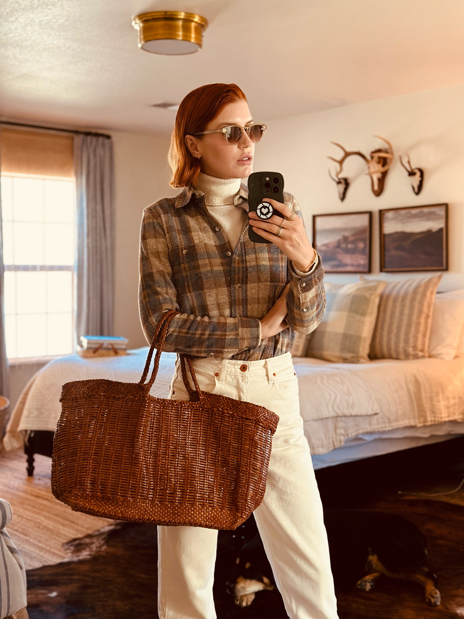 I am excited for the crisp weather here at our ranch - the mornings are chilly and the late afternoons warm up a little. I layer so I can add and subtract throughout the day. 
I am really big on buying pieces that *BUILD* a wardrobe- not stand-alone items that last a season. 
When you think about layering, you need various textures and patterns and weights - but they all need to coordinate. Plaid is great to layer but hear me- it’s not just any plaid. This one is fitted and stretchy and has a flannel feel- AND it’s a perfect neutral for layering. You don’t need a million plaid shirts- you need one and this is it. 
Same with tote bags. I have had my black tote for more than a decade. I have been wearing more brown so I just got this woven leather brown one - which coordinates with my brown shoes and boots. 
Last thing 😜 don’t sleep on these pants. They are my top sold item and I haven’t seen a single return. They are perfectly cream, flattering and modern, in a great preppy 90s way. I wear them year-round and this is THE pair. 