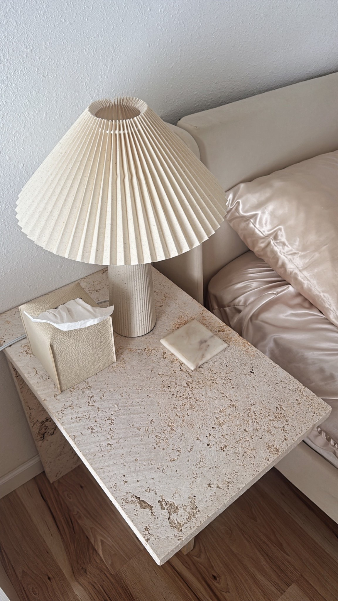 DIY travertine nightstands with a pleated ceramic lamp.. can’t forget the silky sheets  🕯️💫

#LTKHome #LTKSaleAlert #LTKFindsUnder50