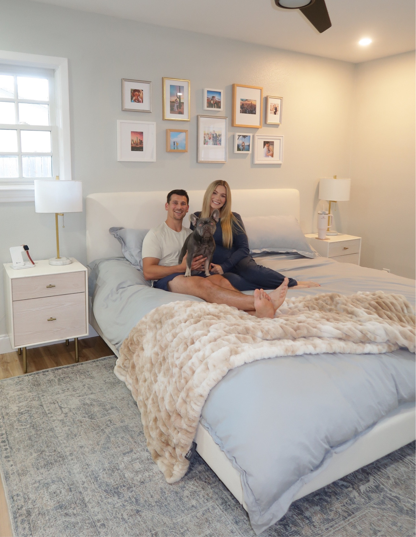 Master bedroom modern night stands, chest of drawers, and upholstered King bed with cozy sheet set and duvet. Framebridge photo wall 

#LTKhome