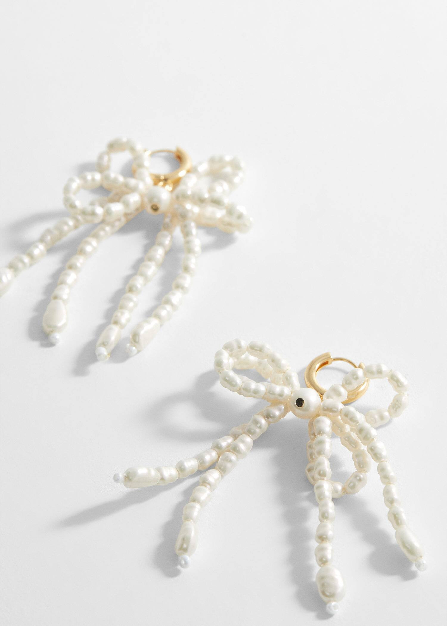 Pearl bow earings | MANGO (UK)