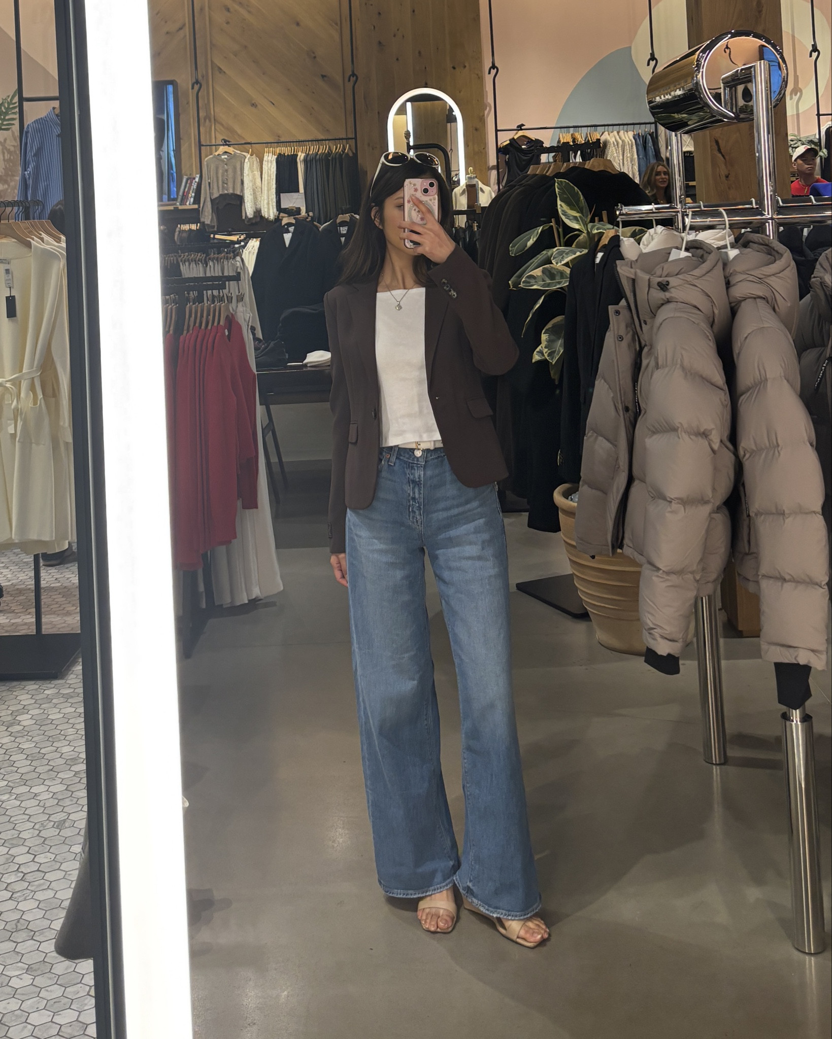 Had been looking for a new blazer that’s fitted (but not toooooo cinched, and definitely not oversized), and not cropped. Found the perfect one with the help of the sales associate!
I’m wearing a long sleeve shirt underneath with a 00, and while it does fit, I sized up to a 0 because I learned that shoulder seam should fall *slightly* past the edge if your shoulder bone (instead of right on it, like this one for me) to make sure the sleeve don’t bunch up. Also looks more flattering and is more comfortable when I bend my arms! 

Paired with AE wide leg jeans linked below. These run big! I am in 000 here and normally my jeans are 0 or 00 depending on brand. I am 5’3.5” and this length is perfect with some heels.  

#LTKWorkwear #LTKTravel #LTKPetite
