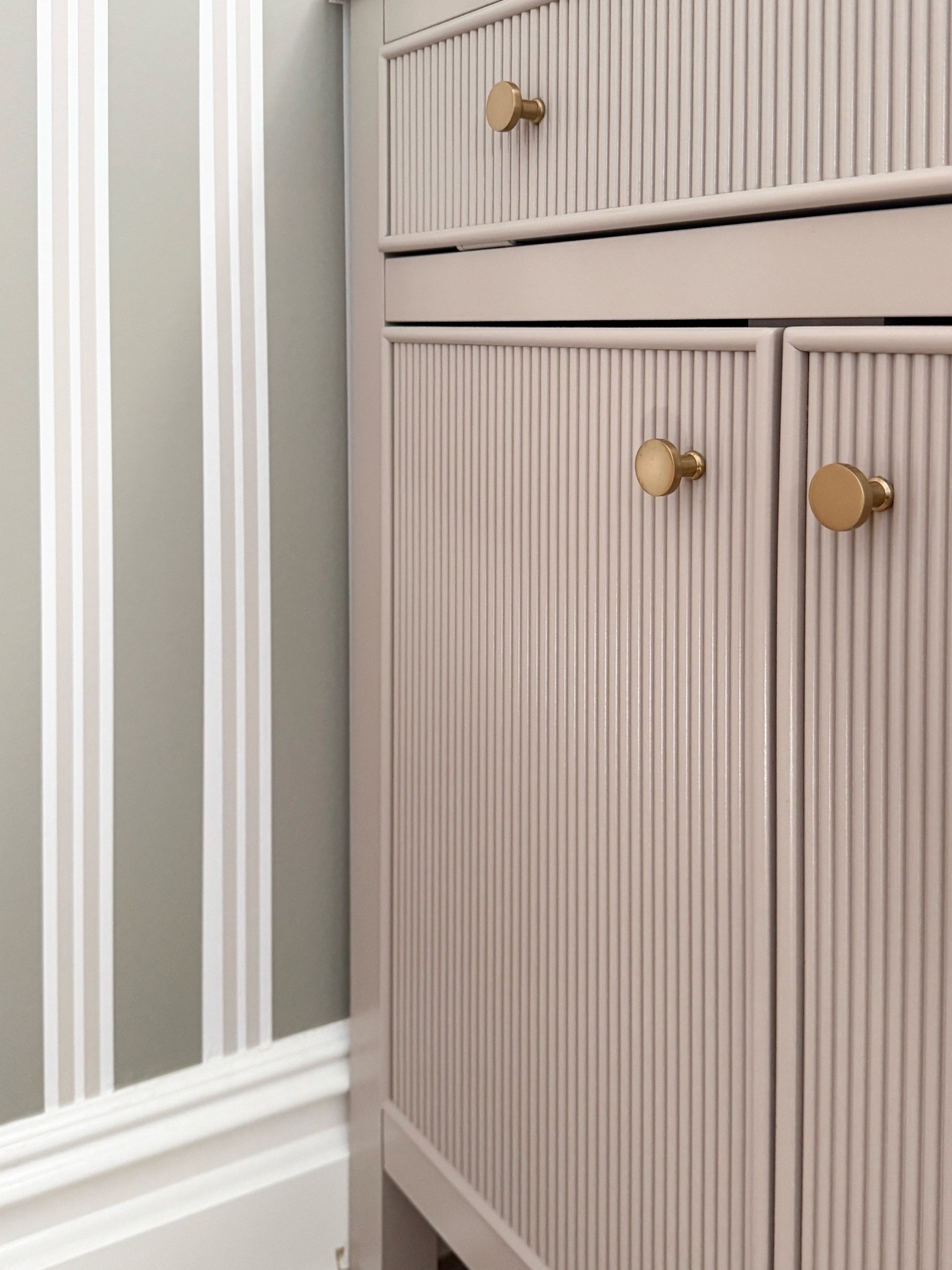 These fluted cabinet fronts paired with simple brass knobs are such a beautiful detail. I love how the soft neutral finish and warm hardware make the piece feel custom without being overly ornate.

fluted cabinet, brass cabinet knobs, cabinet hardware, bathroom vanity, textured cabinet doors, neutral bathroom decor, classic home details, furniture hardware, timeless interiors, home renovation ideas, girlonthehudson

#LTKSeasonal #LTKHome #LTKdayinmylife